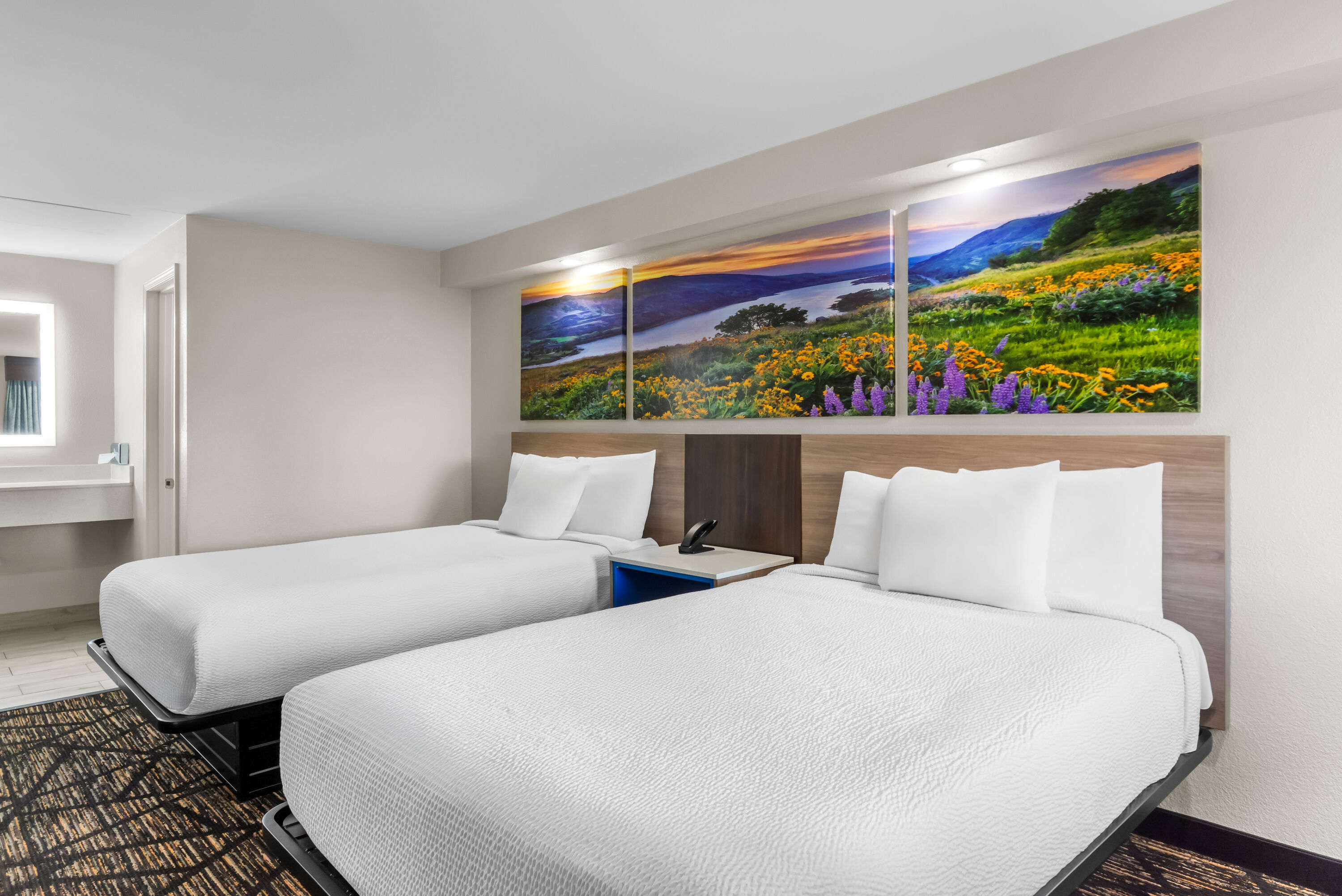 Double bed guest room at the Days Inn by Wyndham Indianapolis East Post Road in Indianapolis, Indiana