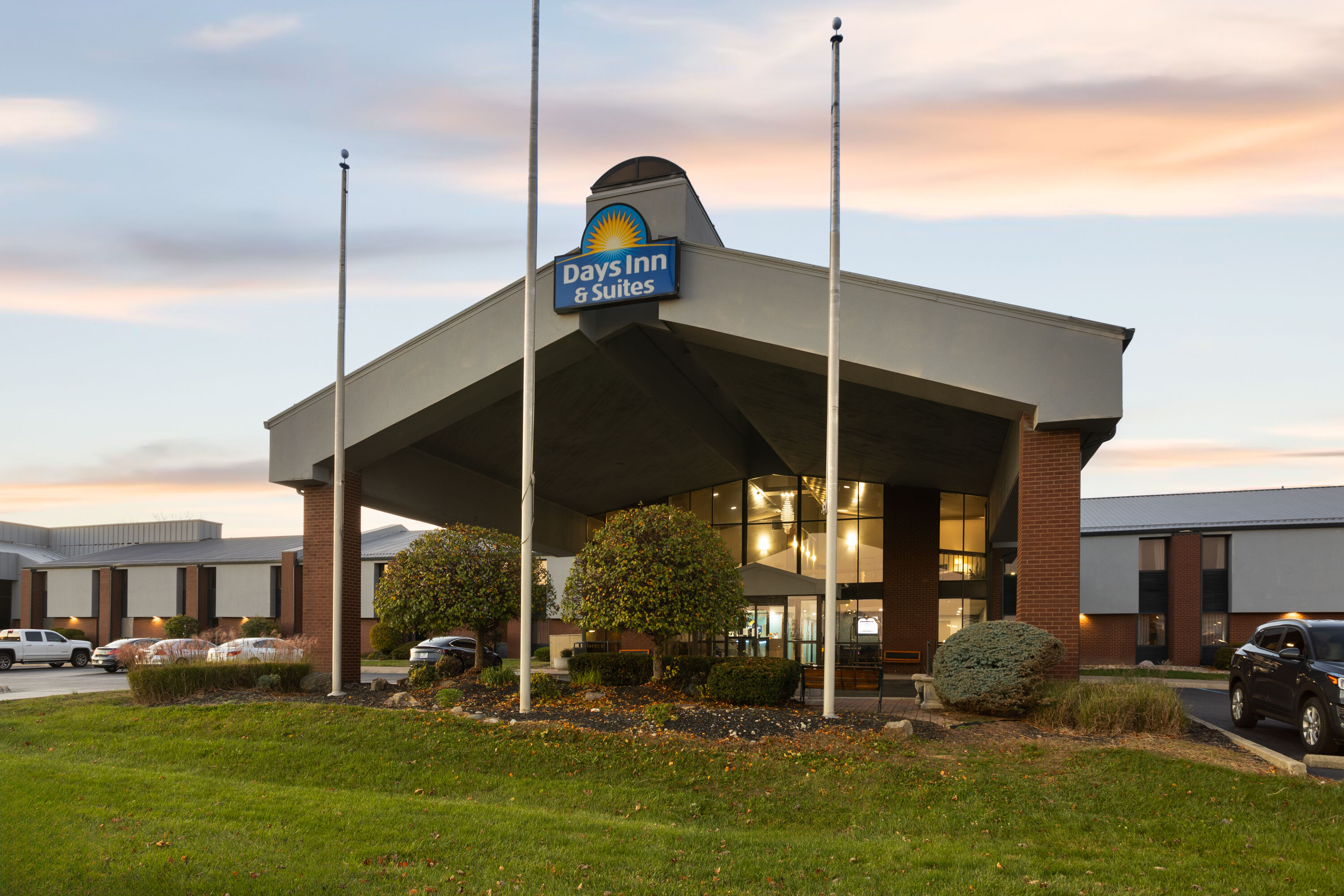 Exterior Dusk Image of Days Inn & Suites by Wyndham Northwest Indianapolis hotel in Indianapolis, Indiana
