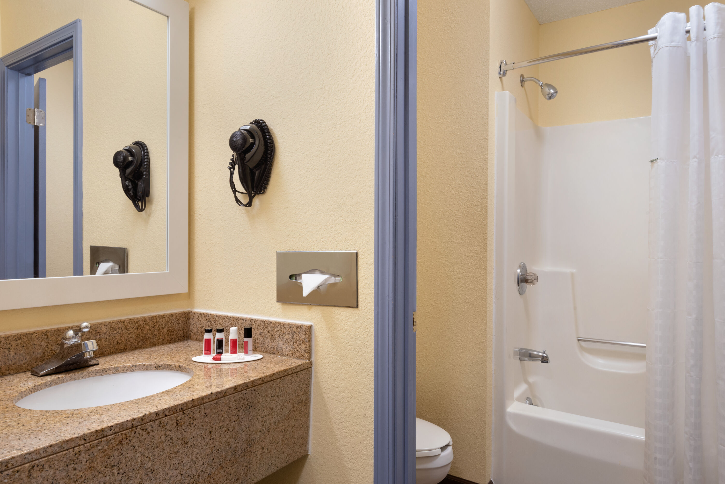 Guest room bath at the Days Inn & Suites by Wyndham Merrillville in Merrillville, Indiana