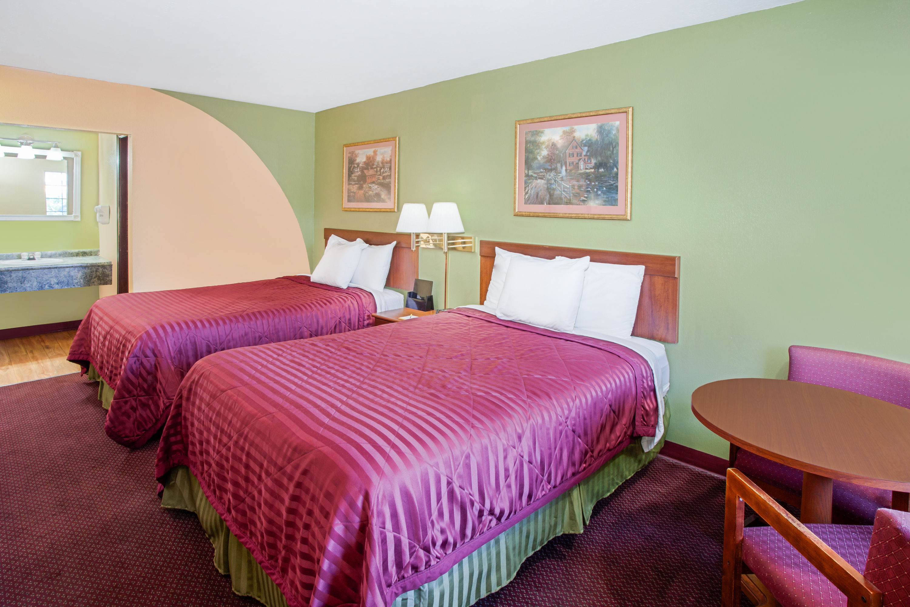 Guest room at the Days Inn & Suites by Wyndham Terre Haute in Terre Haute, Indiana