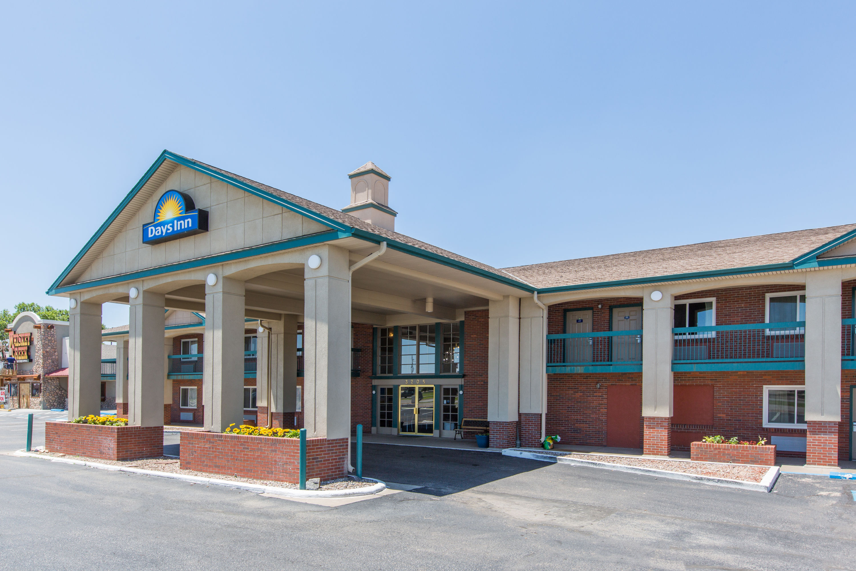 Exterior Day Image of Days Inn by Wyndham Hays hotel in Hays, Kansas