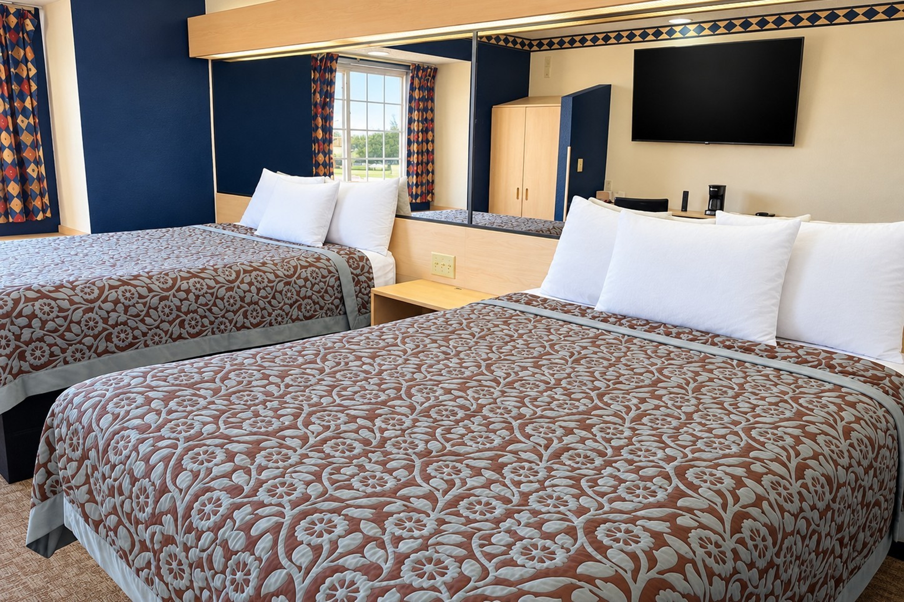 Guest room at the Days Inn & Suites by Wyndham Hutchinson in Hutchinson, Kansas