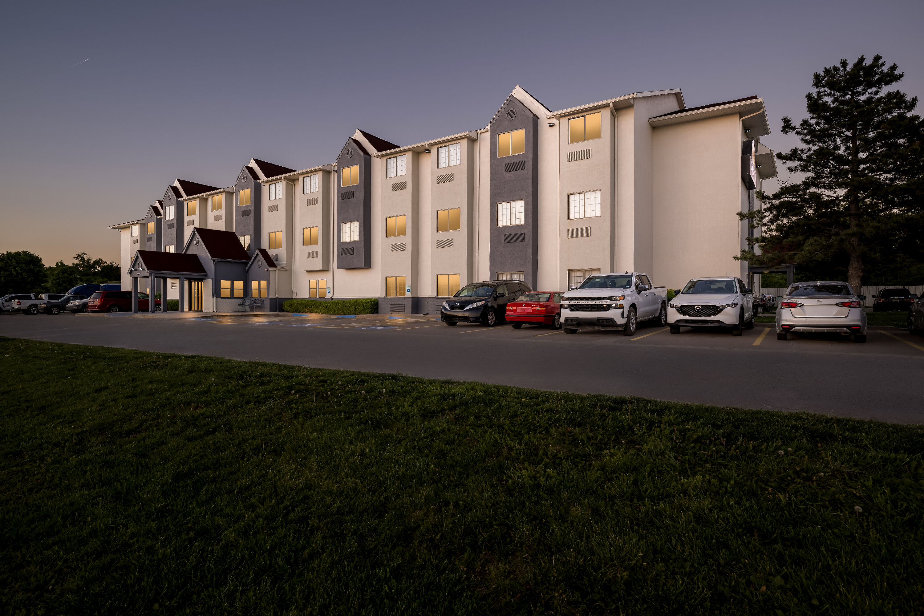 Exterior Night Image of Days Inn by Wyndham near Kansas Speedway hotel in Kansas City, Kansas