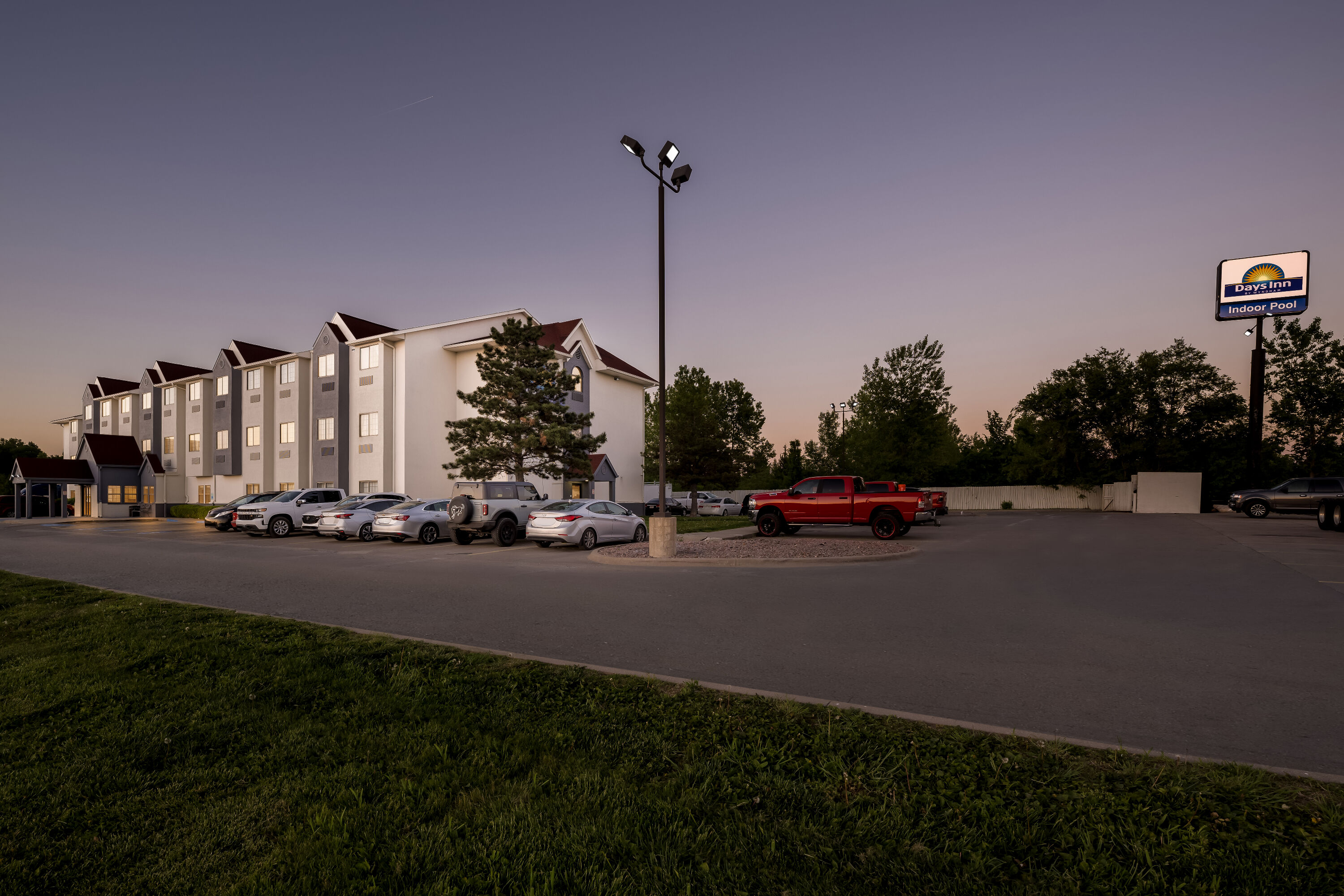 Exterior Night Image of Days Inn by Wyndham near Kansas Speedway hotel in Kansas City, Kansas