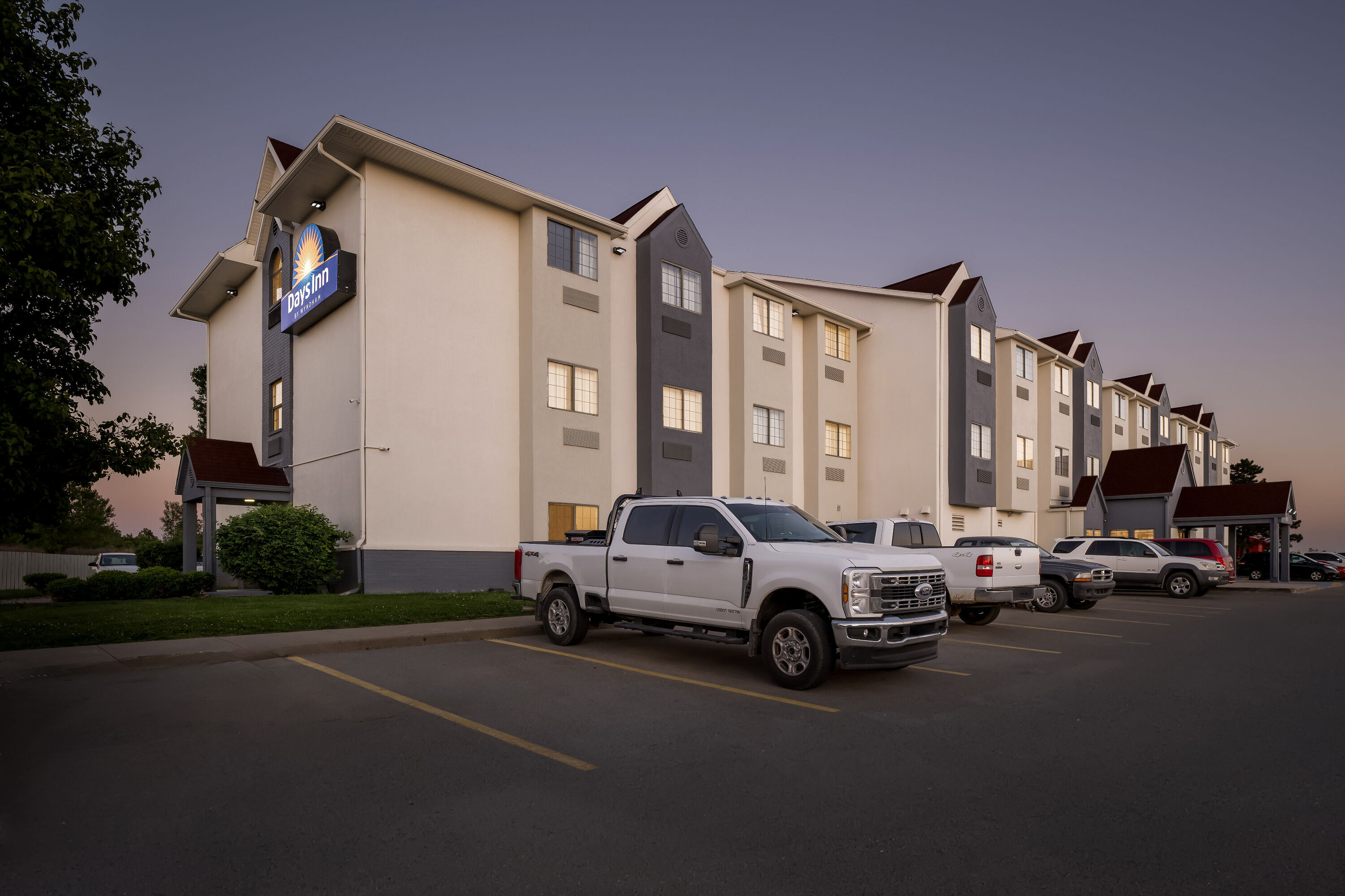 Exterior Night Image of Days Inn by Wyndham near Kansas Speedway hotel in Kansas City, Kansas