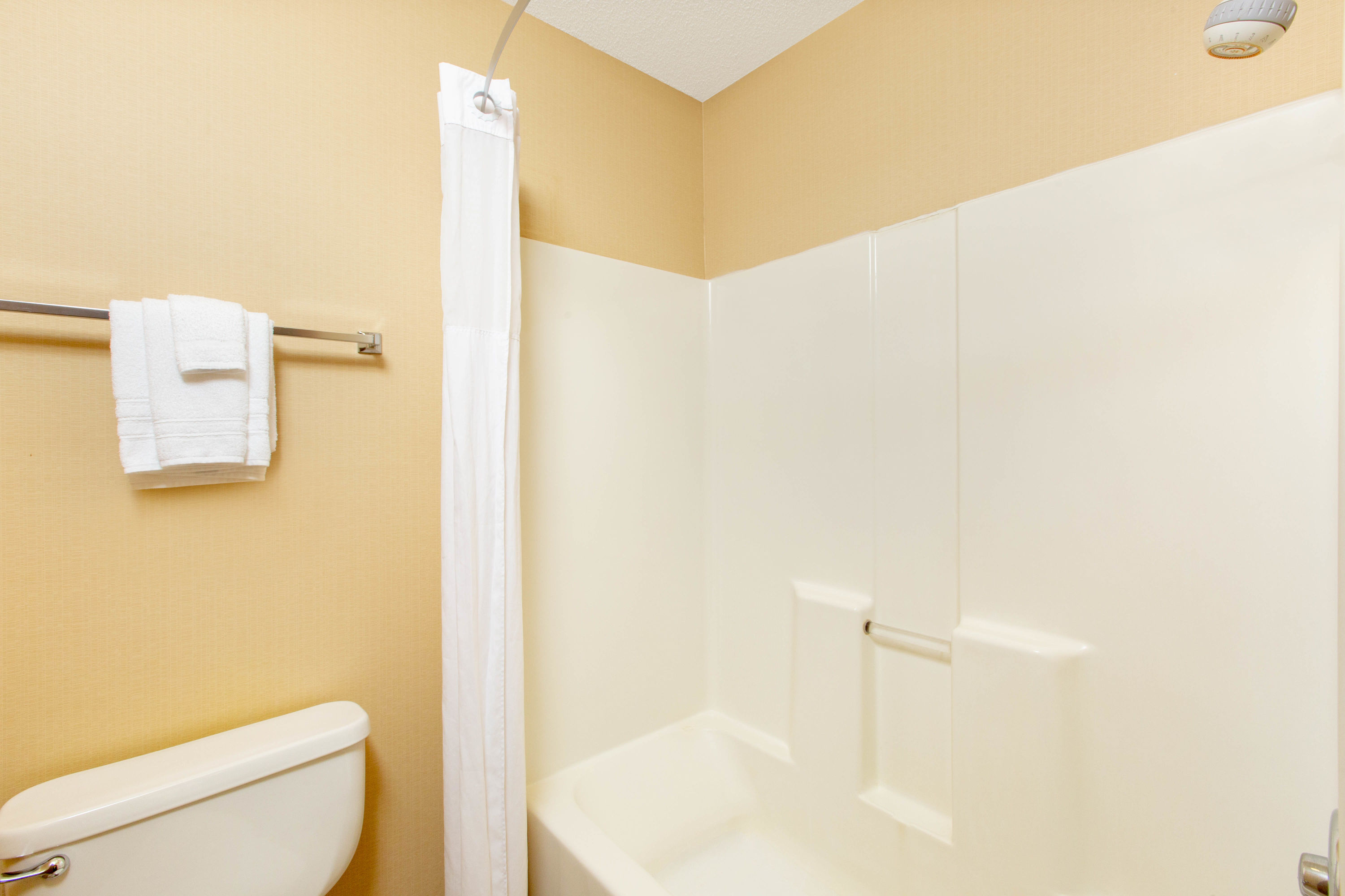 Guest room bath at the Days Inn by Wyndham Salina I-70 in Salina, Kansas