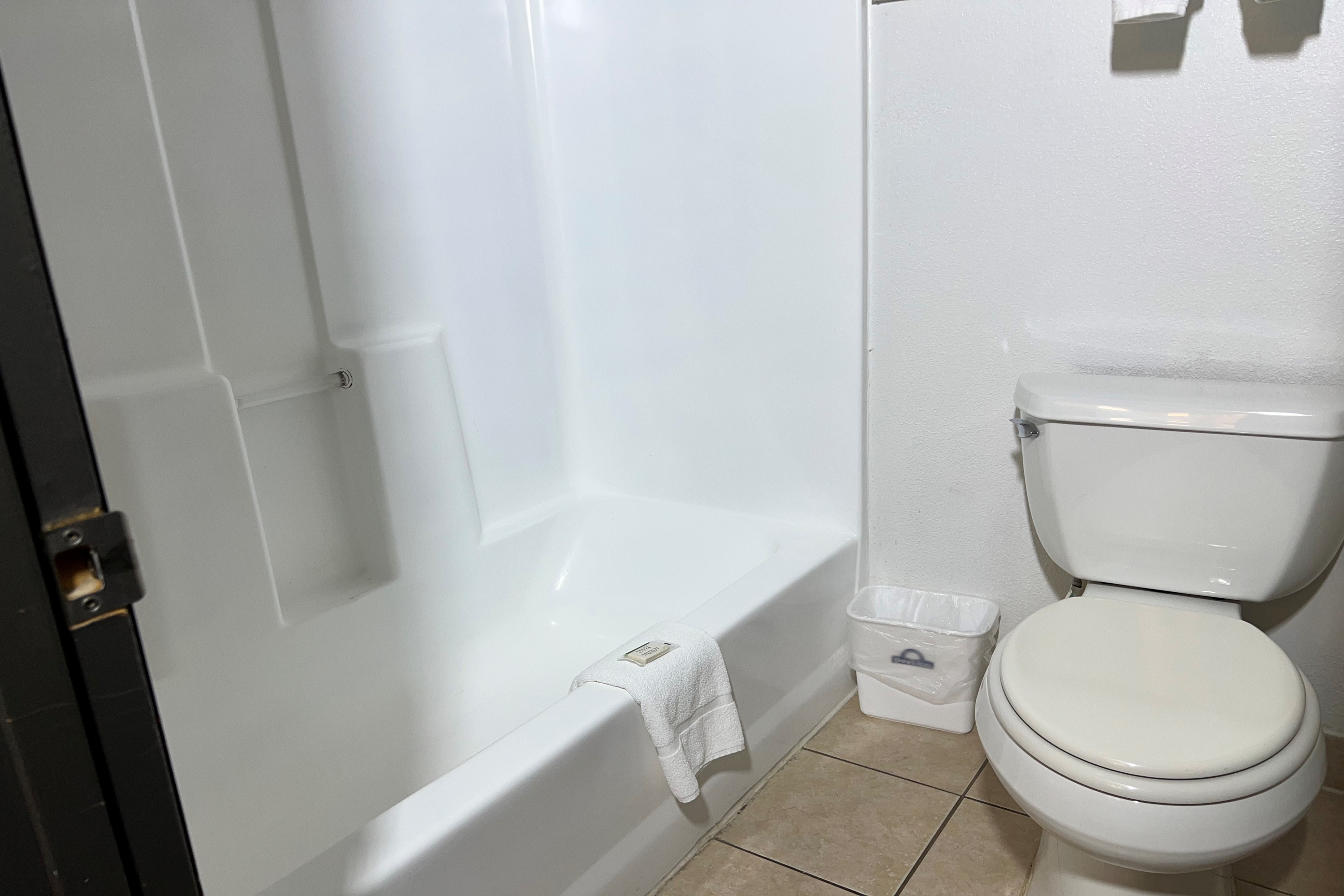 Guest room bath at the Days Inn by Wyndham Salina I-70 in Salina, Kansas