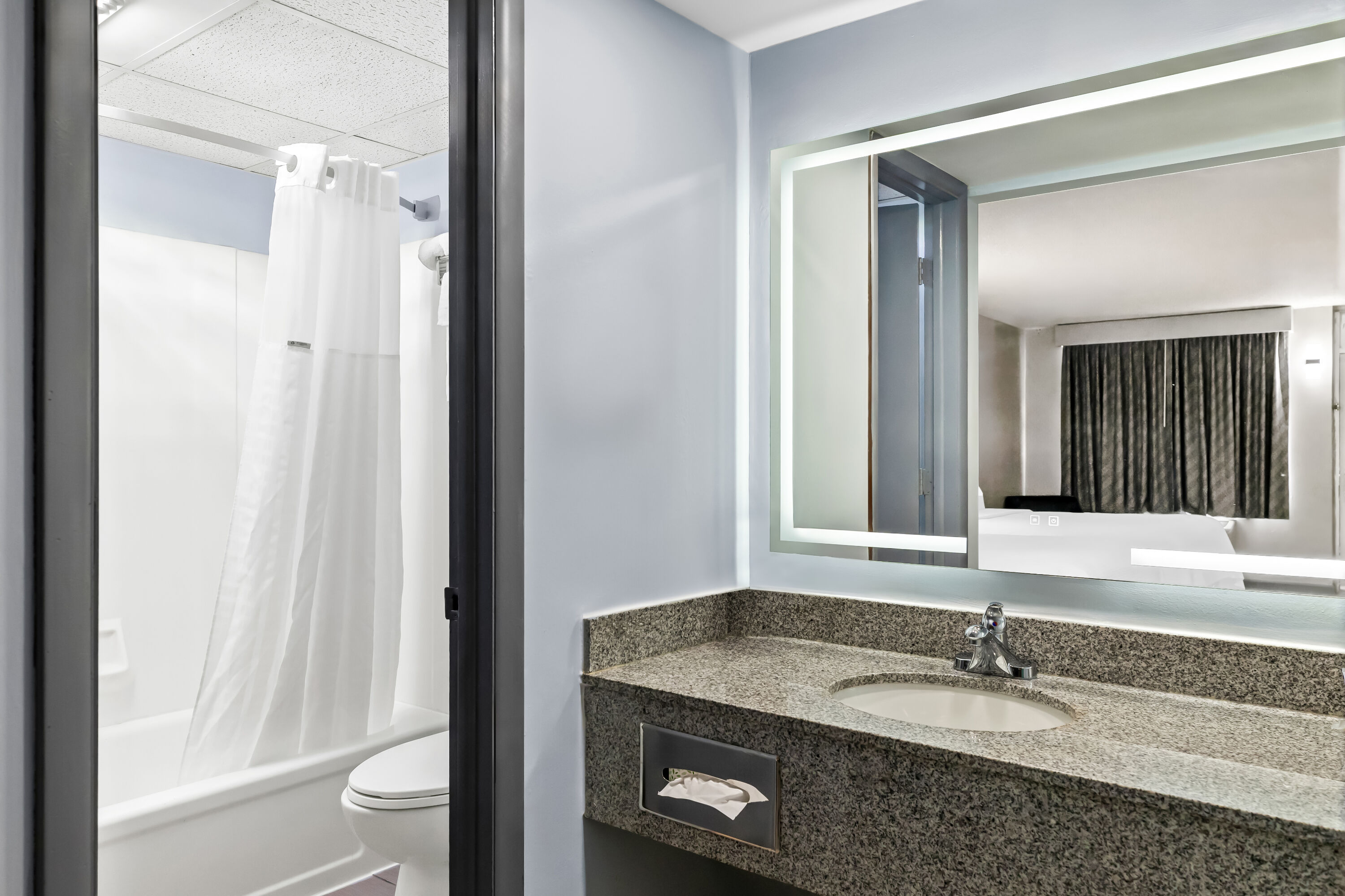 Guest room bath at the Days Inn by Wyndham Salina South in Salina, Kansas