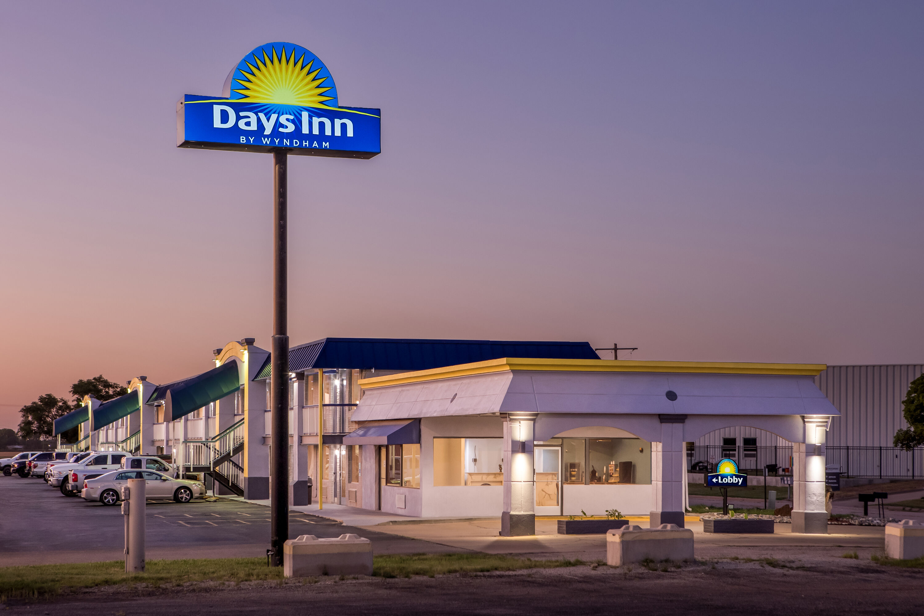 Exterior Night Image of Days Inn by Wyndham Salina South hotel in Salina, Kansas