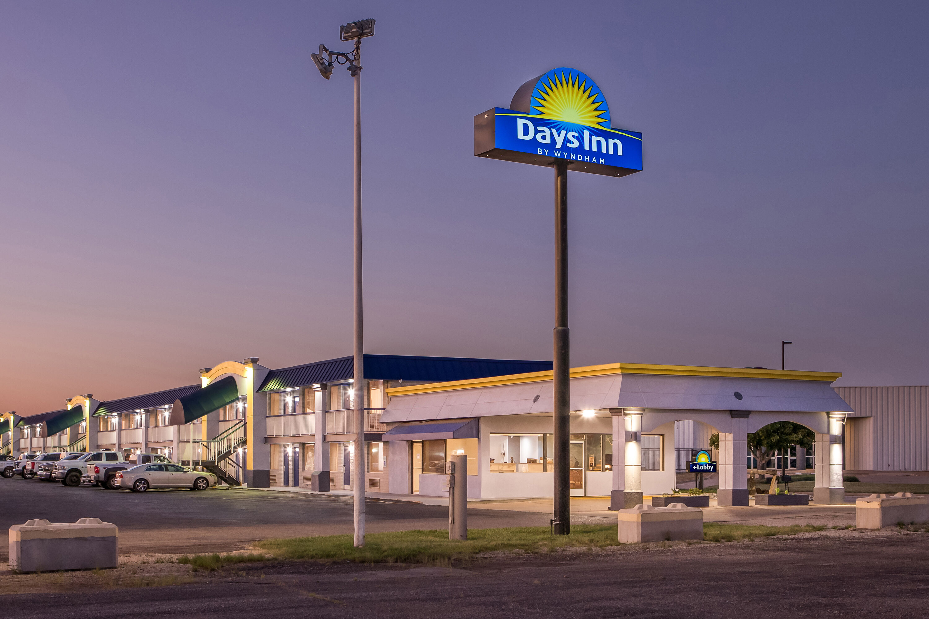 Exterior Night Image of Days Inn by Wyndham Salina South hotel in Salina, Kansas