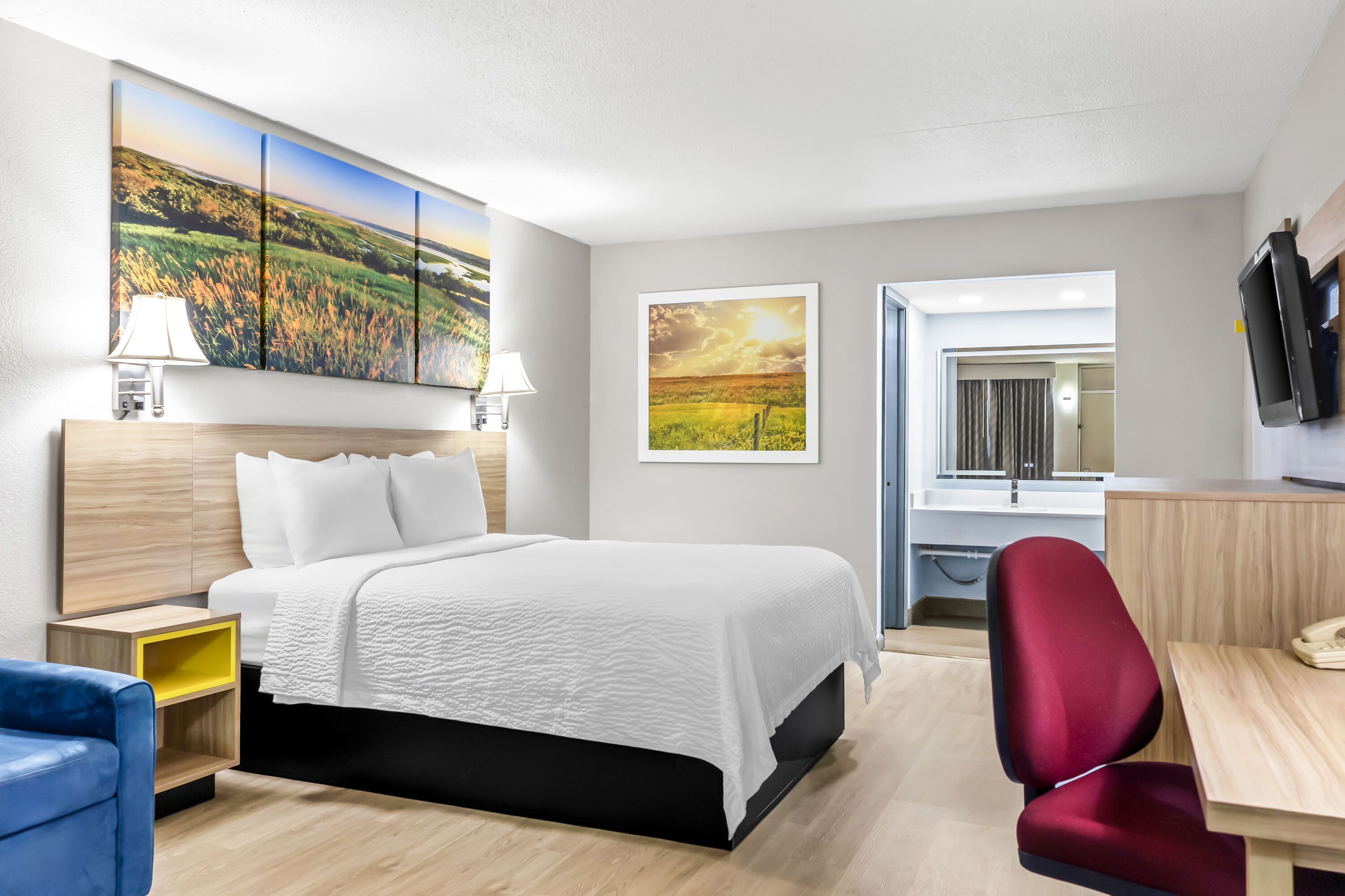 Queen bed guest room at the Days Inn by Wyndham Salina South in Salina, Kansas