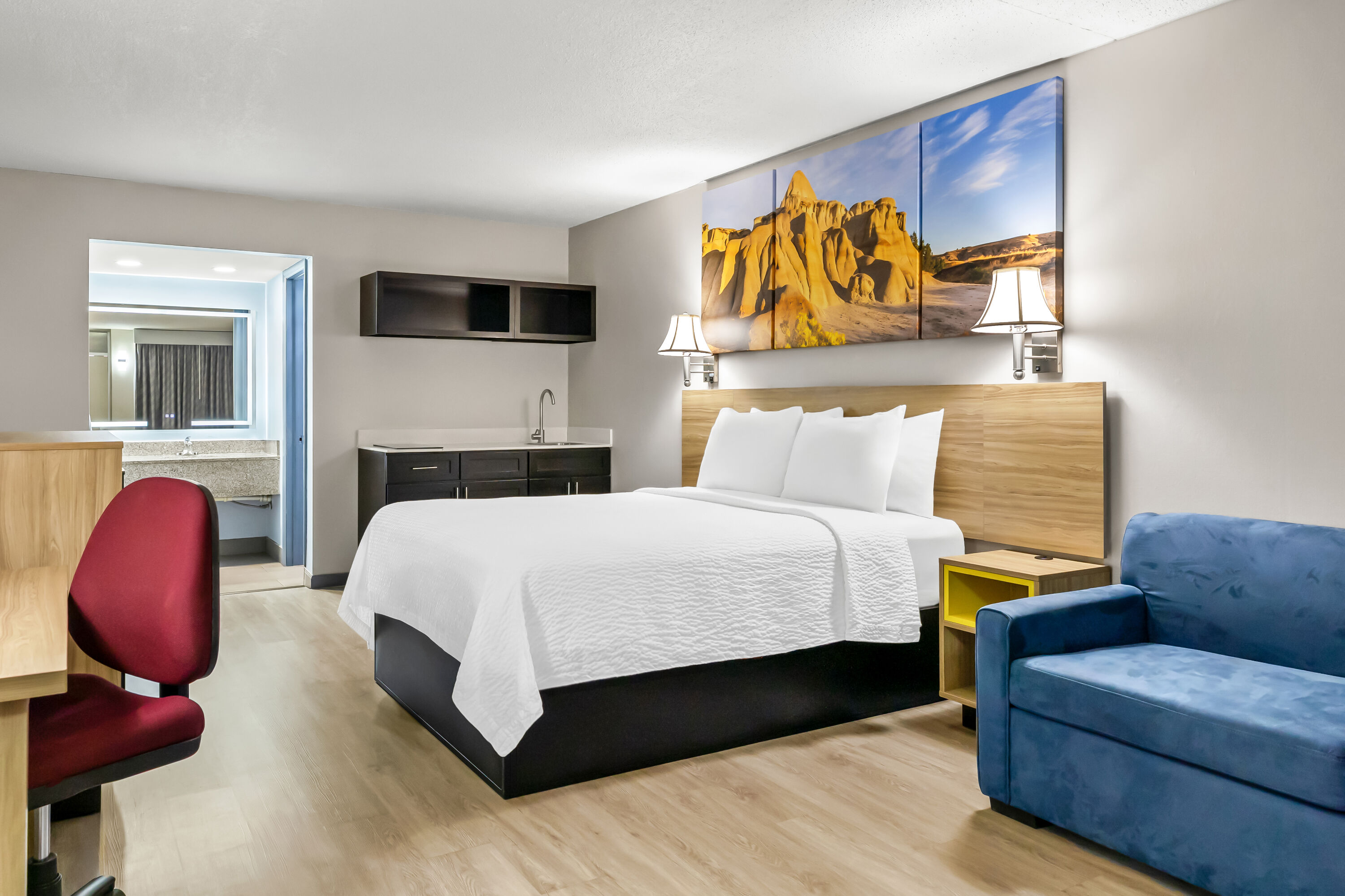 Queen bed guest room at the Days Inn by Wyndham Salina South in Salina, Kansas