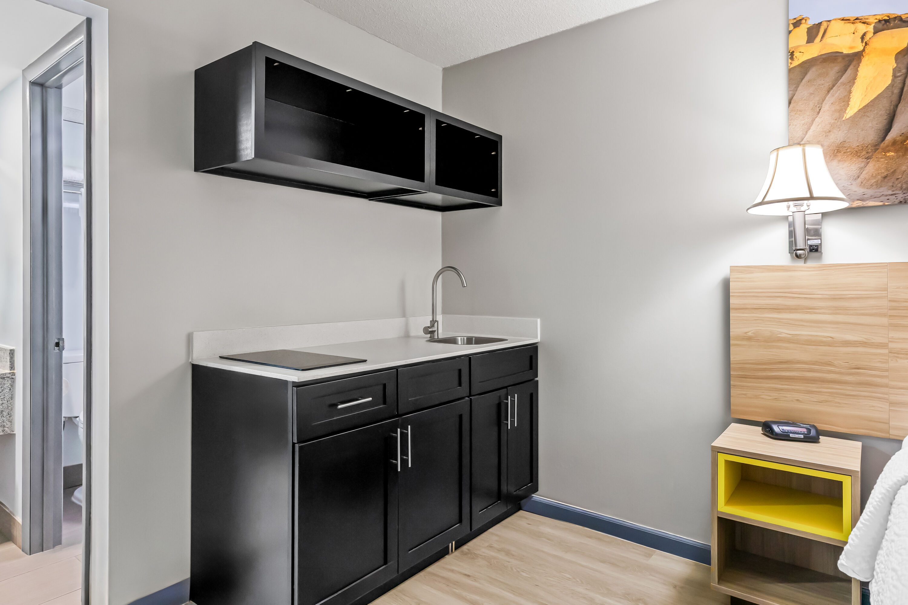 Queen bed guest room at the Days Inn by Wyndham Salina South in Salina, Kansas