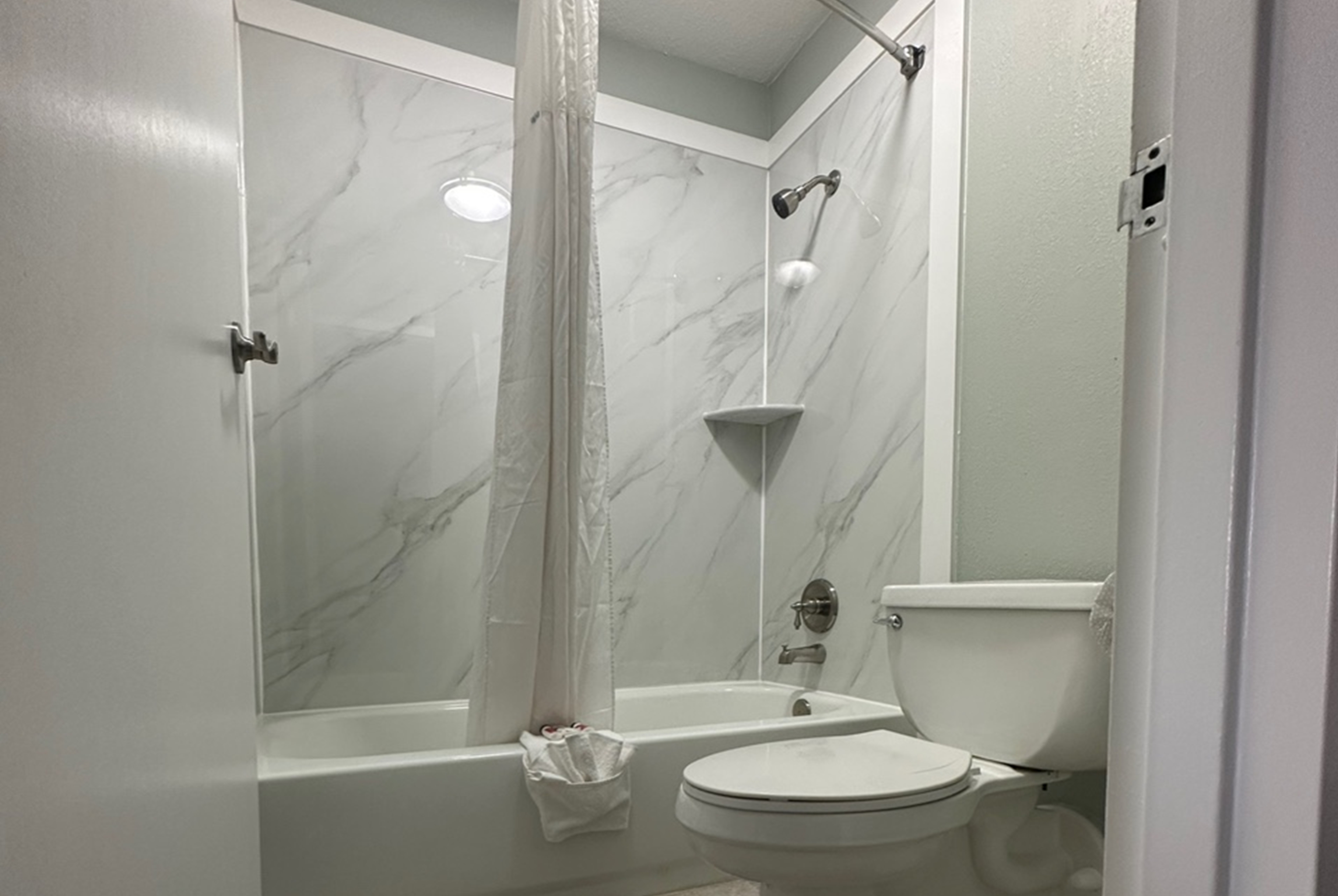 Guest room bath at the Days Inn & Suites by Wyndham Jennings in Jennings, Louisiana