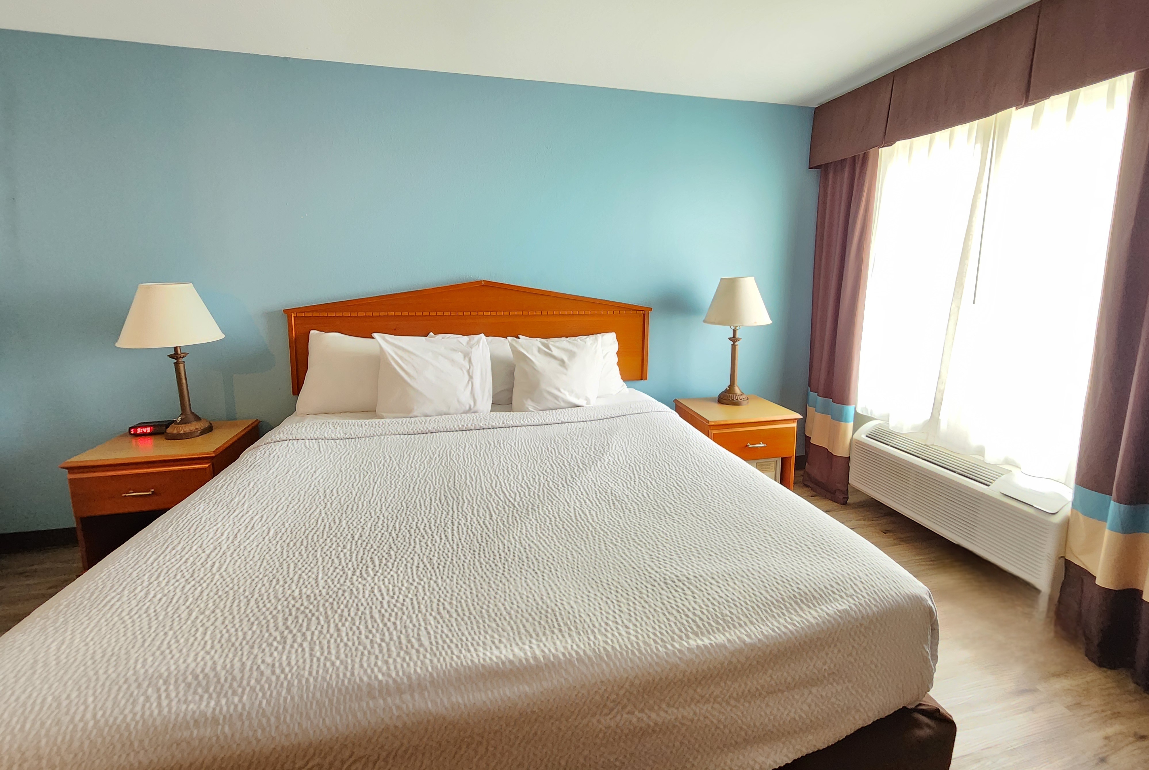 Guest room at the Days Inn & Suites by Wyndham Thibodaux in Thibodaux, Louisiana