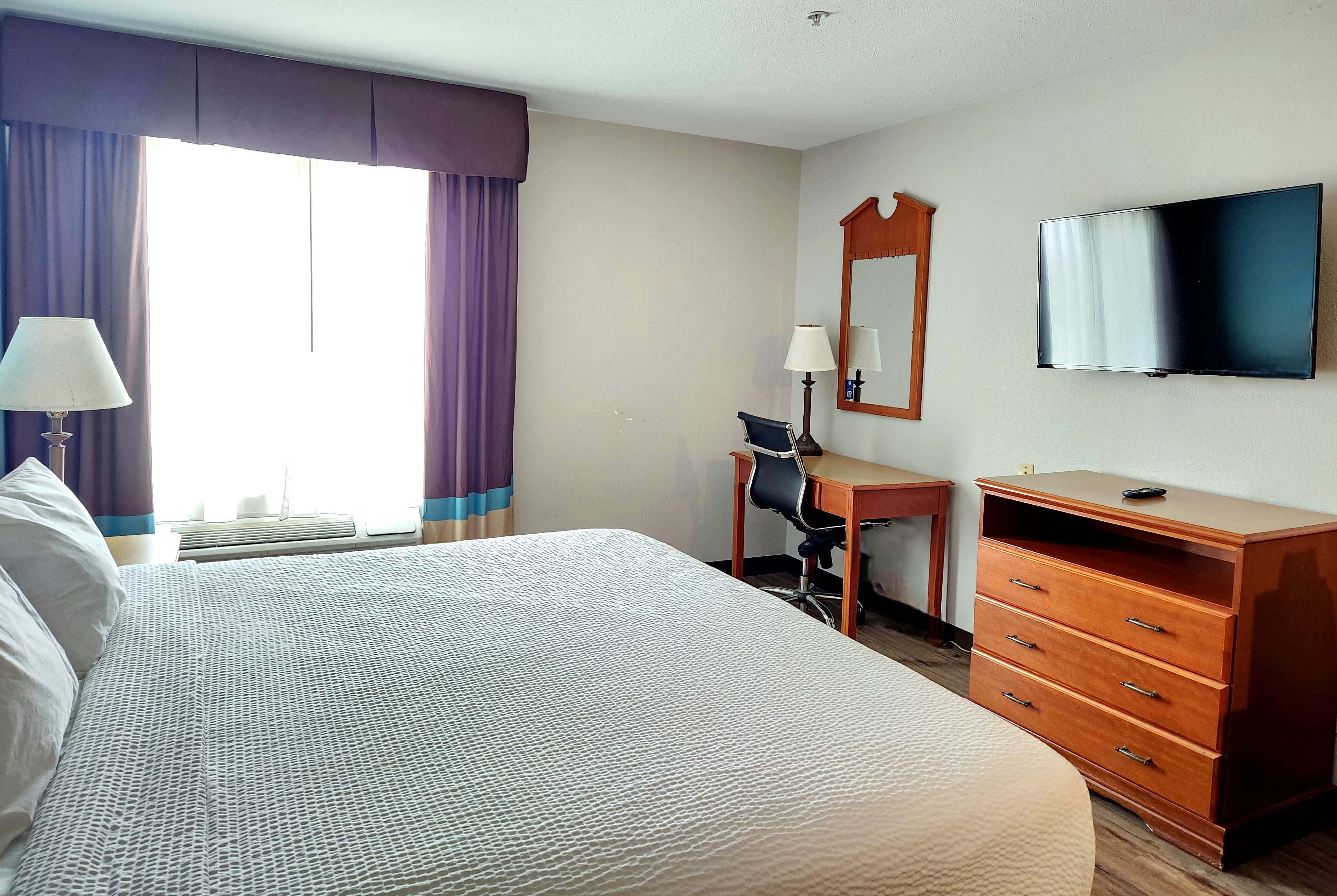 Guest room at the Days Inn & Suites by Wyndham Thibodaux in Thibodaux, Louisiana