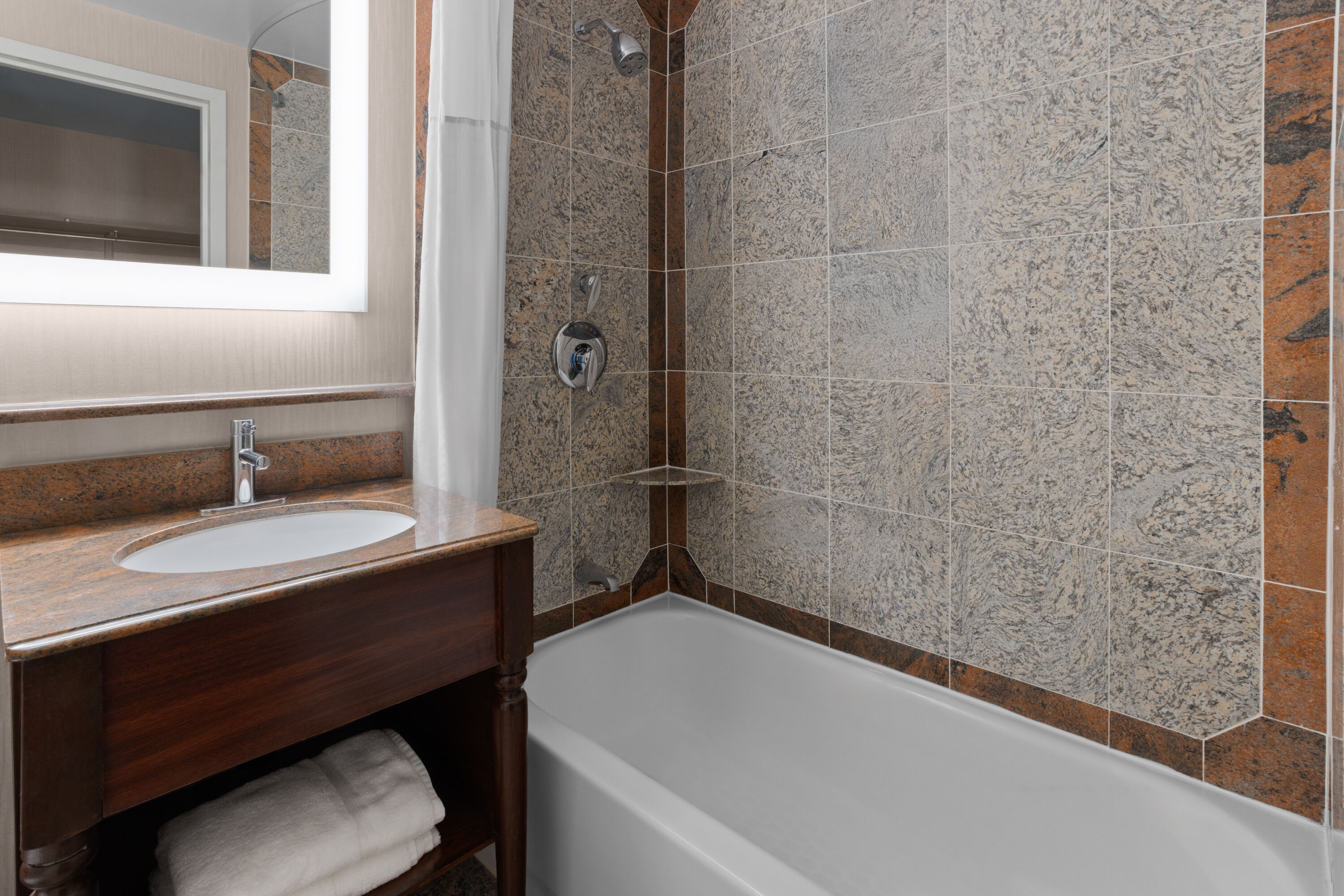 Guest room bath at the Days Inn by Wyndham Lanham Washington DC in Lanham, Maryland