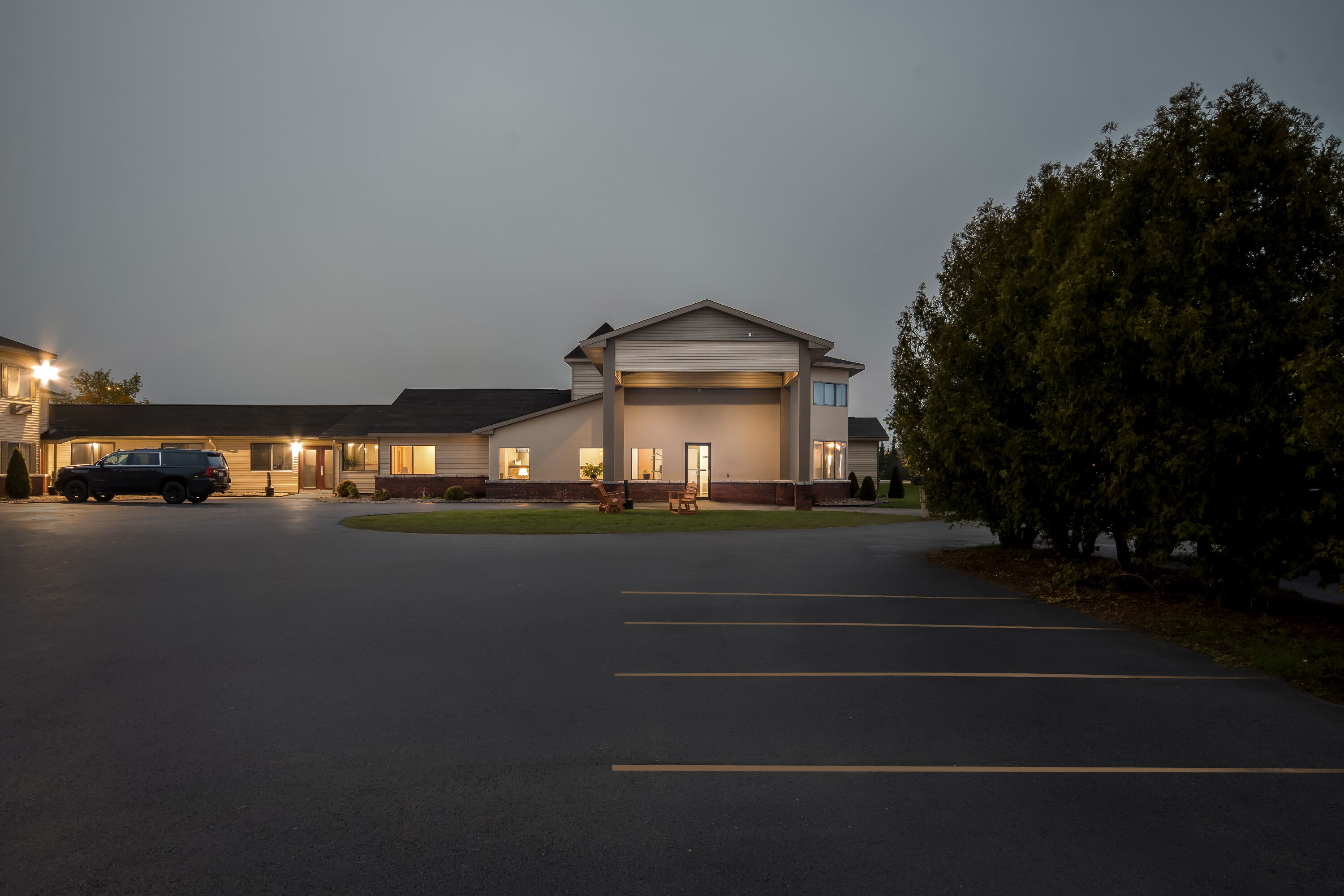 Exterior Night Image of Days Inn by Wyndham Alpena hotel in Alpena, Michigan