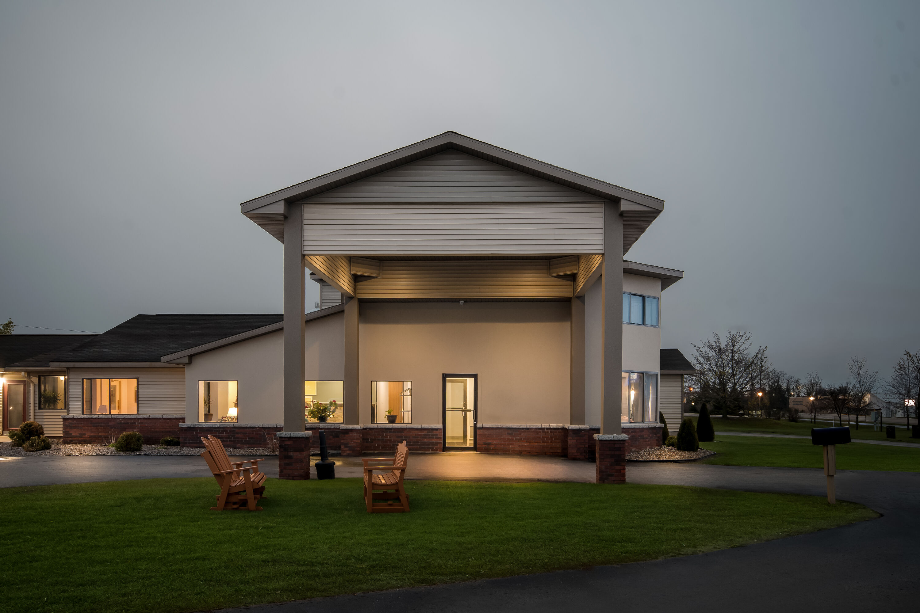 Exterior Night Image of Days Inn by Wyndham Alpena hotel in Alpena, Michigan
