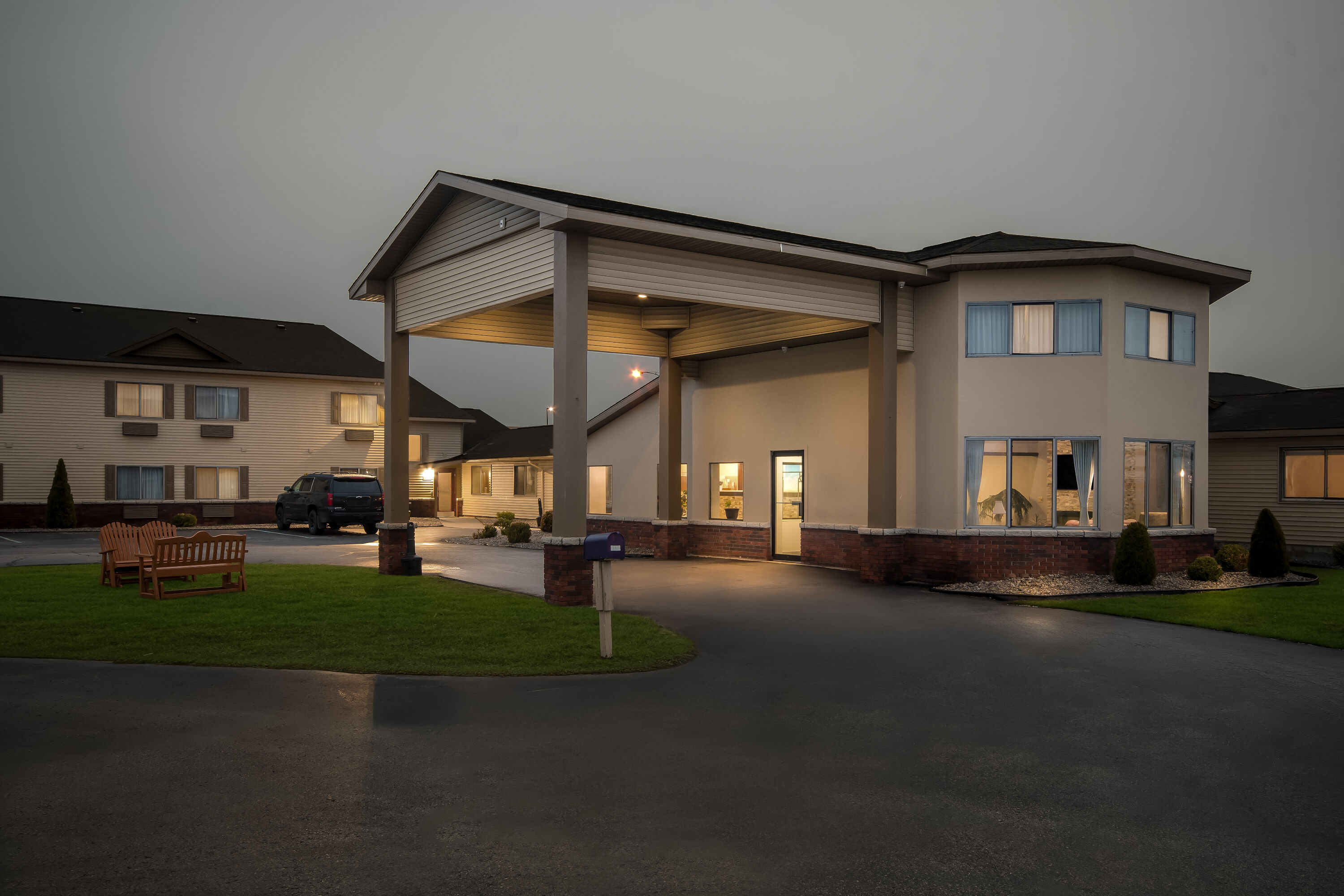 Exterior Night Image of Days Inn by Wyndham Alpena hotel in Alpena, Michigan