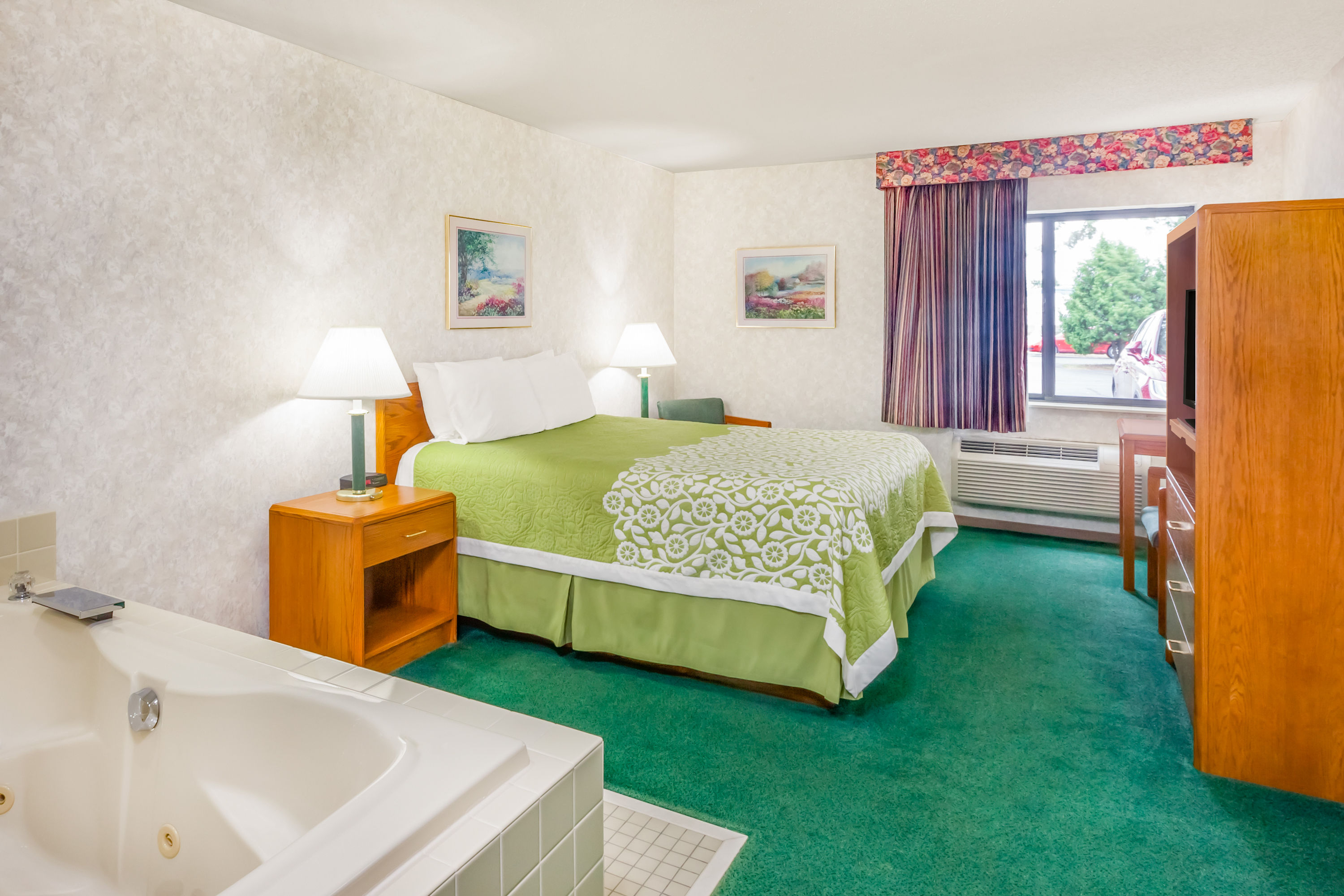 Guest room at the Days Inn by Wyndham Alpena in Alpena, Michigan