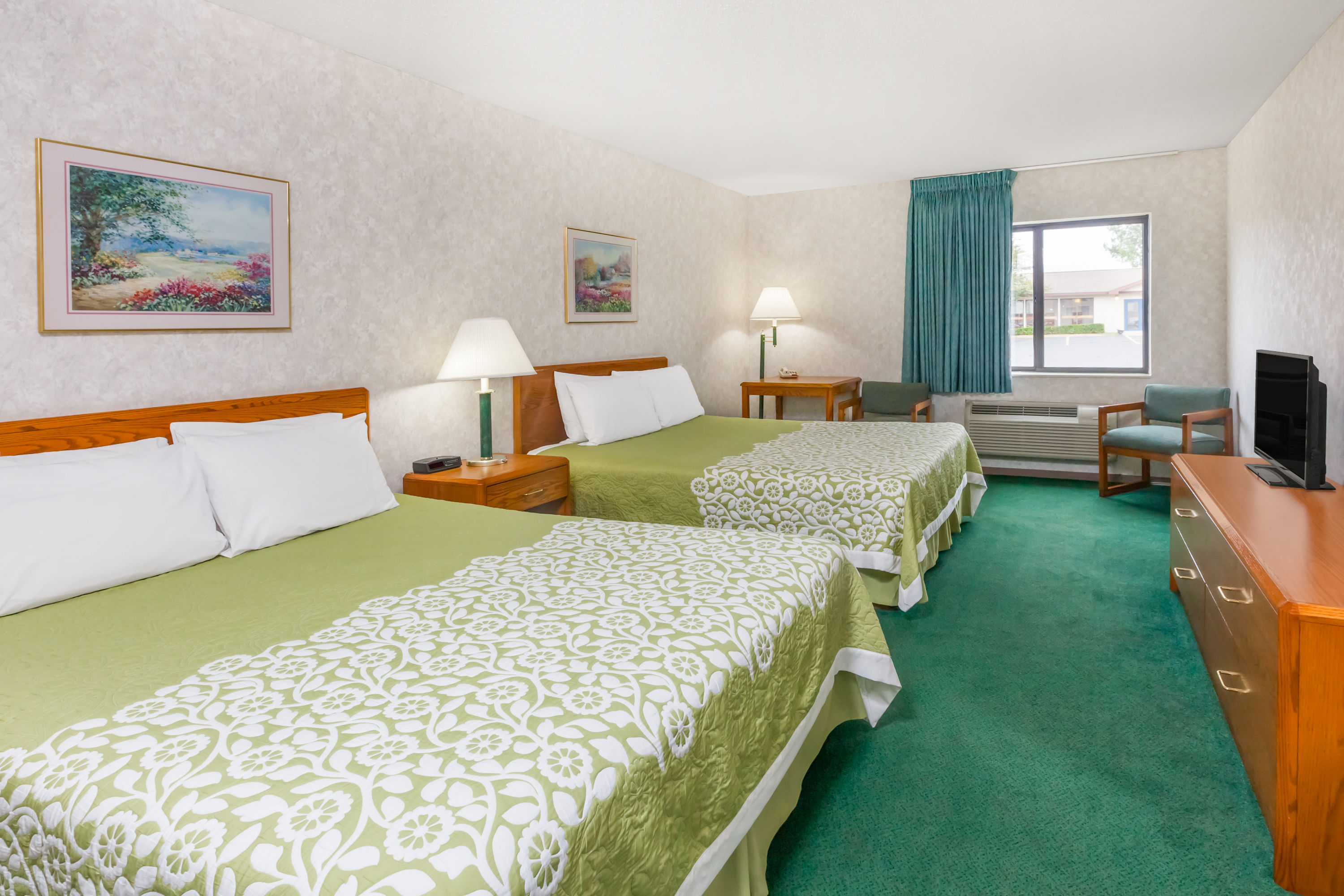 Guest room at the Days Inn by Wyndham Alpena in Alpena, Michigan