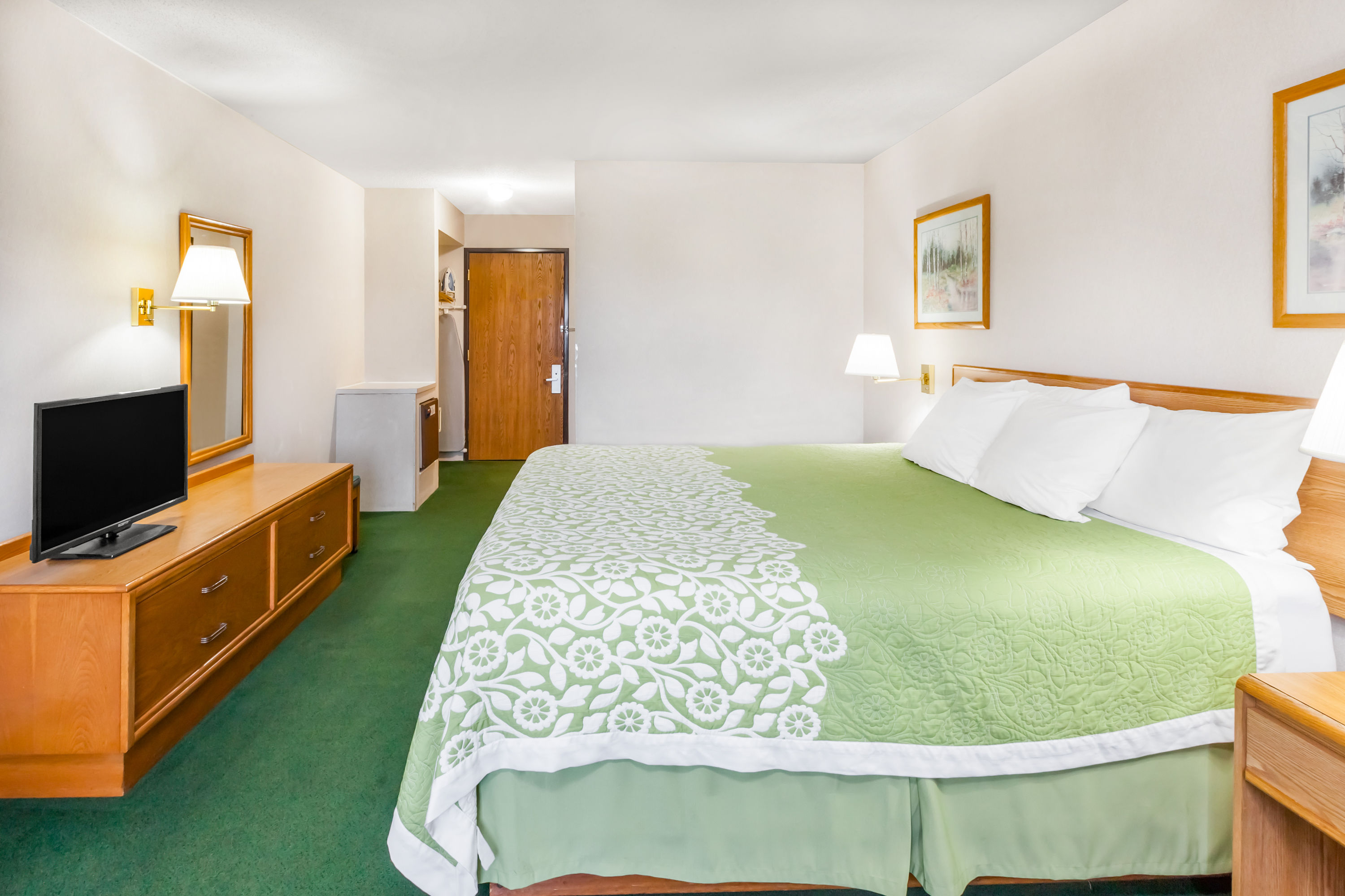 Guest room at the Days Inn by Wyndham Alpena in Alpena, Michigan