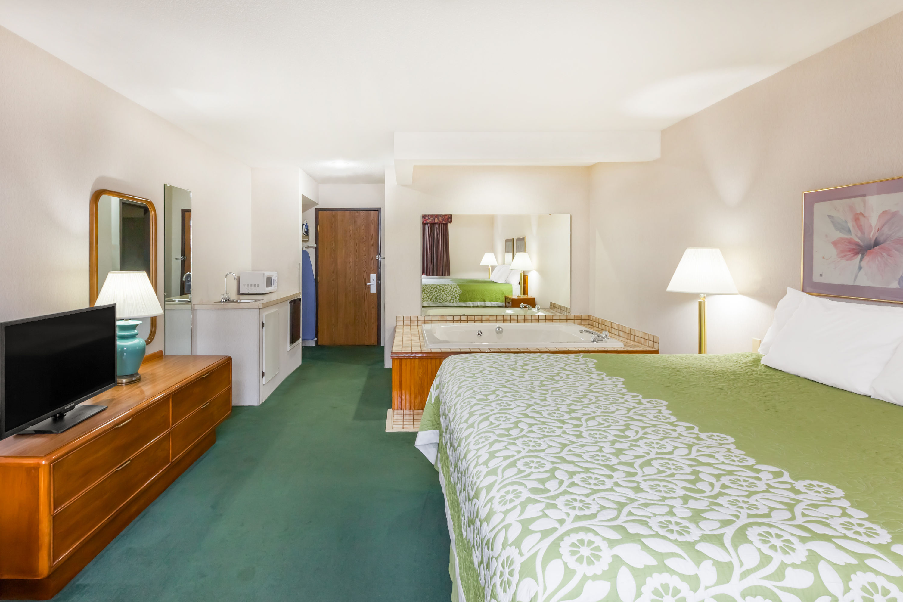 Guest room at the Days Inn by Wyndham Alpena in Alpena, Michigan