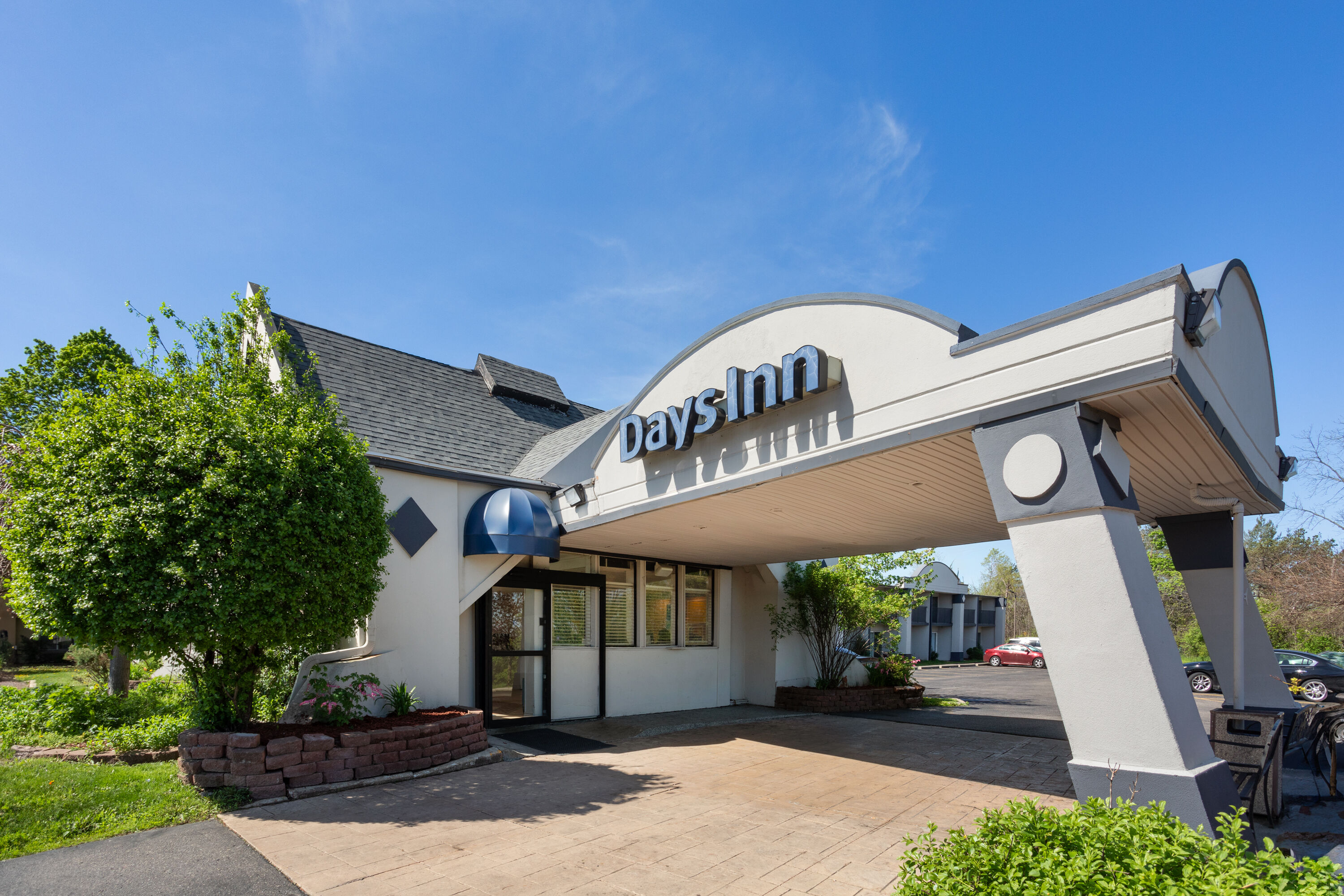 Exterior Day Image of Days Inn by Wyndham Ann Arbor hotel in Ann Arbor, Michigan