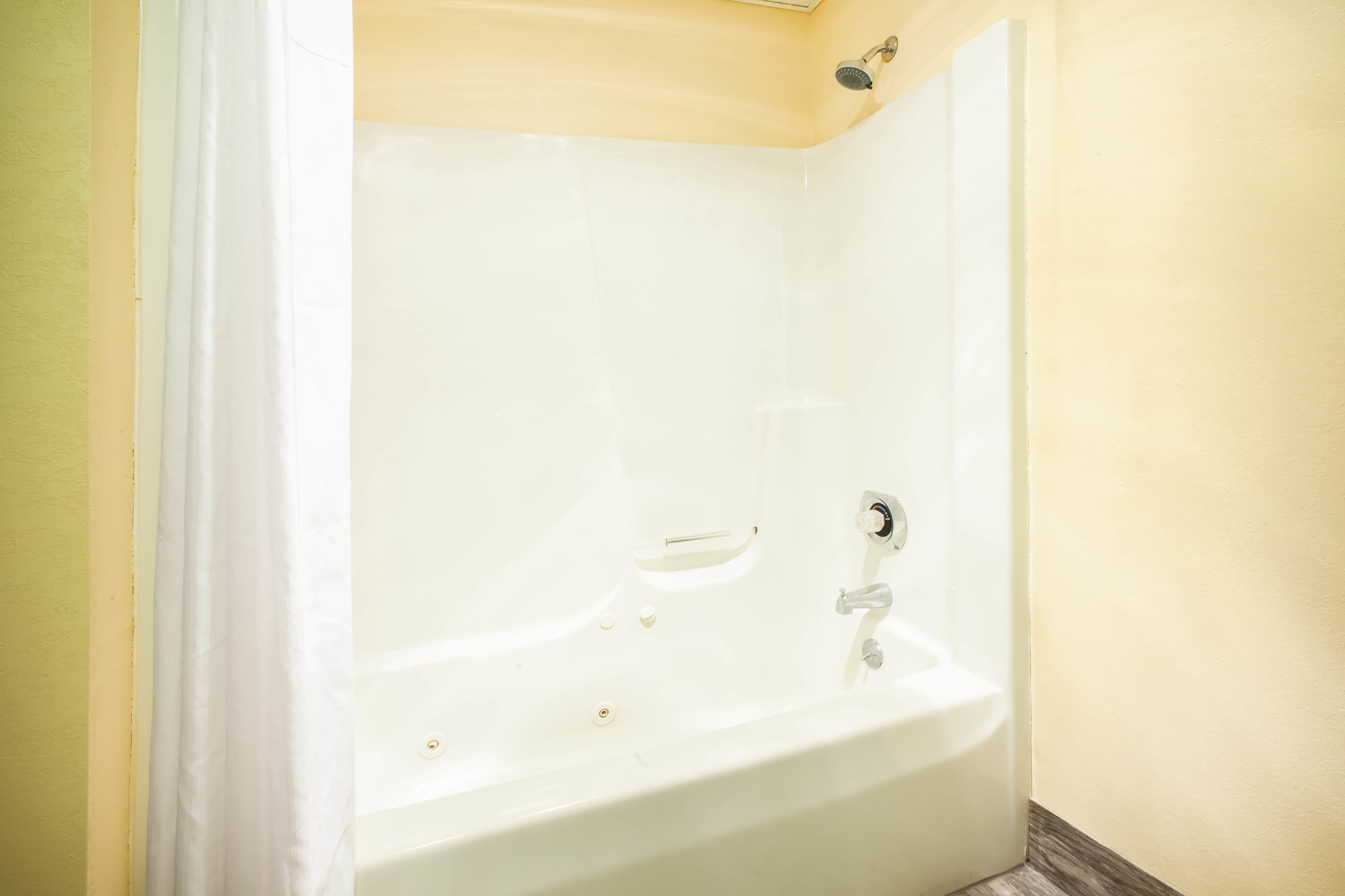 Guest room bath at the Days Inn by Wyndham Cadillac in Cadillac, Michigan