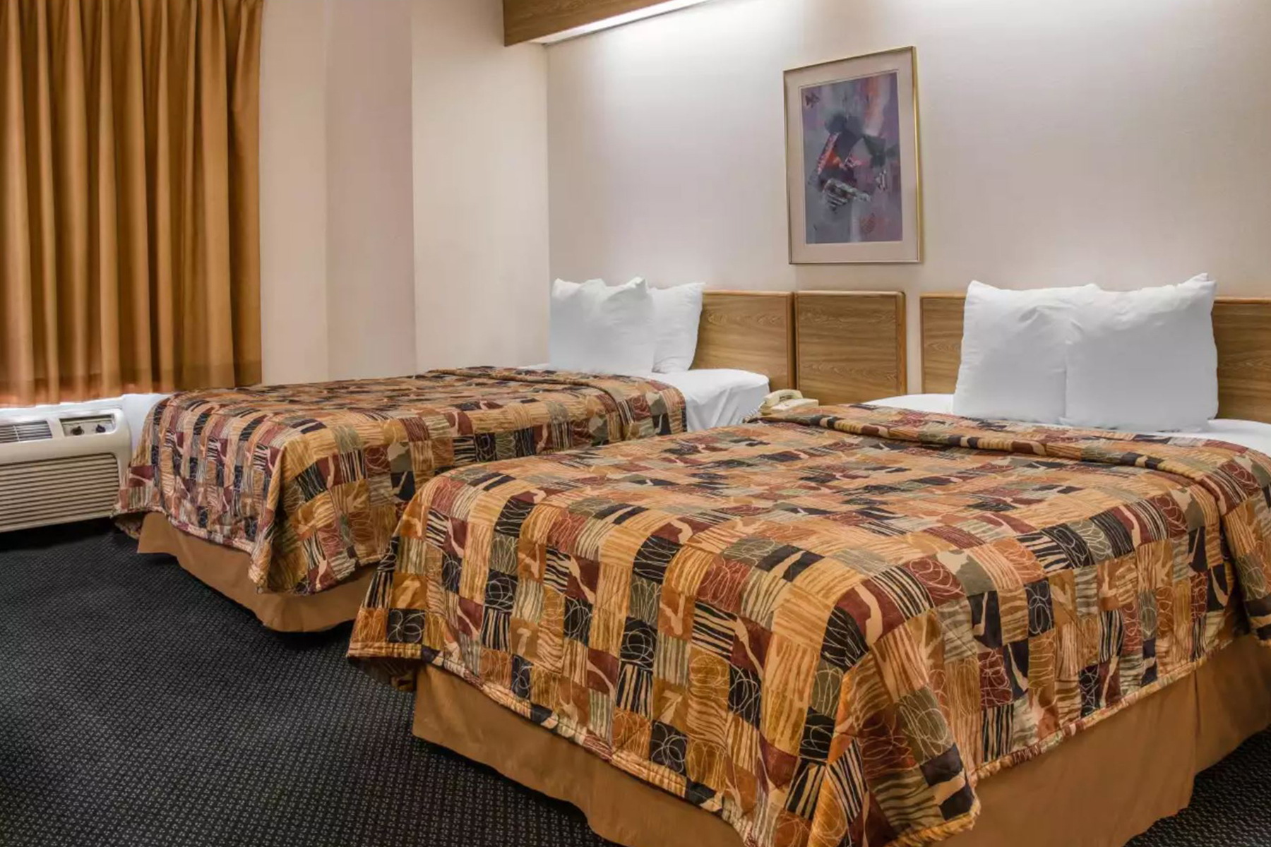 Guest room at the Days Inn by Wyndham Flint/Bishop International Airport in Flint, Michigan