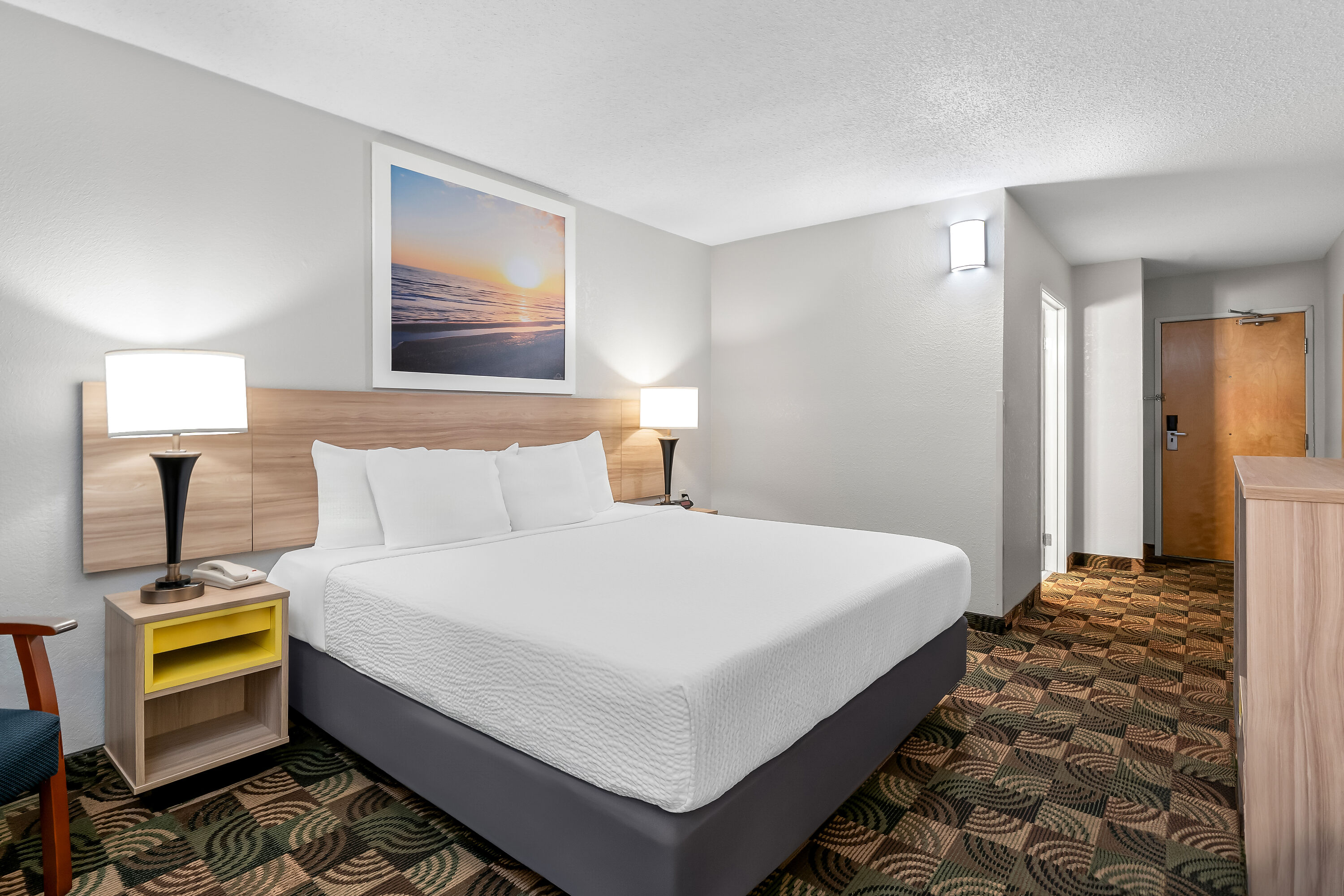 King bed guest room at the Days Inn by Wyndham Hillsdale in Hillsdale, Michigan