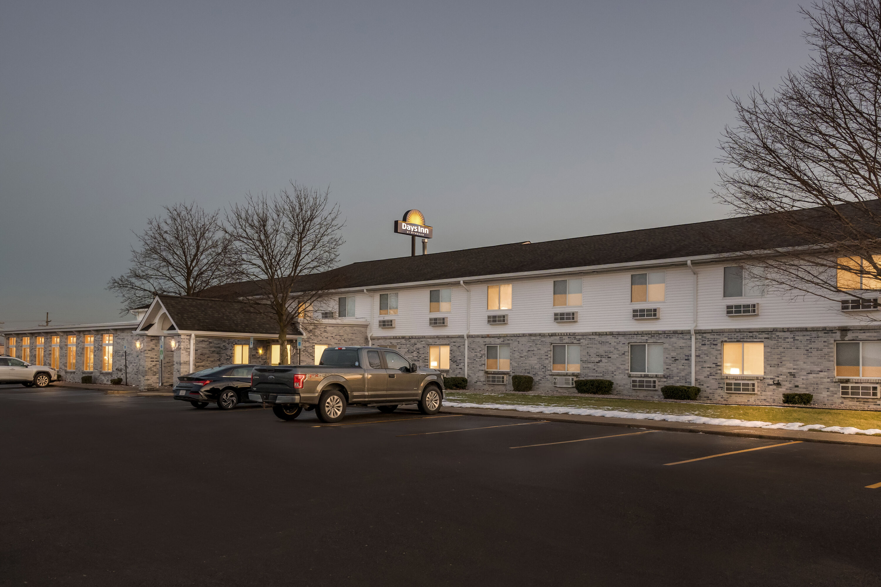 Exterior Night Image of Days Inn by Wyndham Imlay City hotel in Imlay City, Michigan