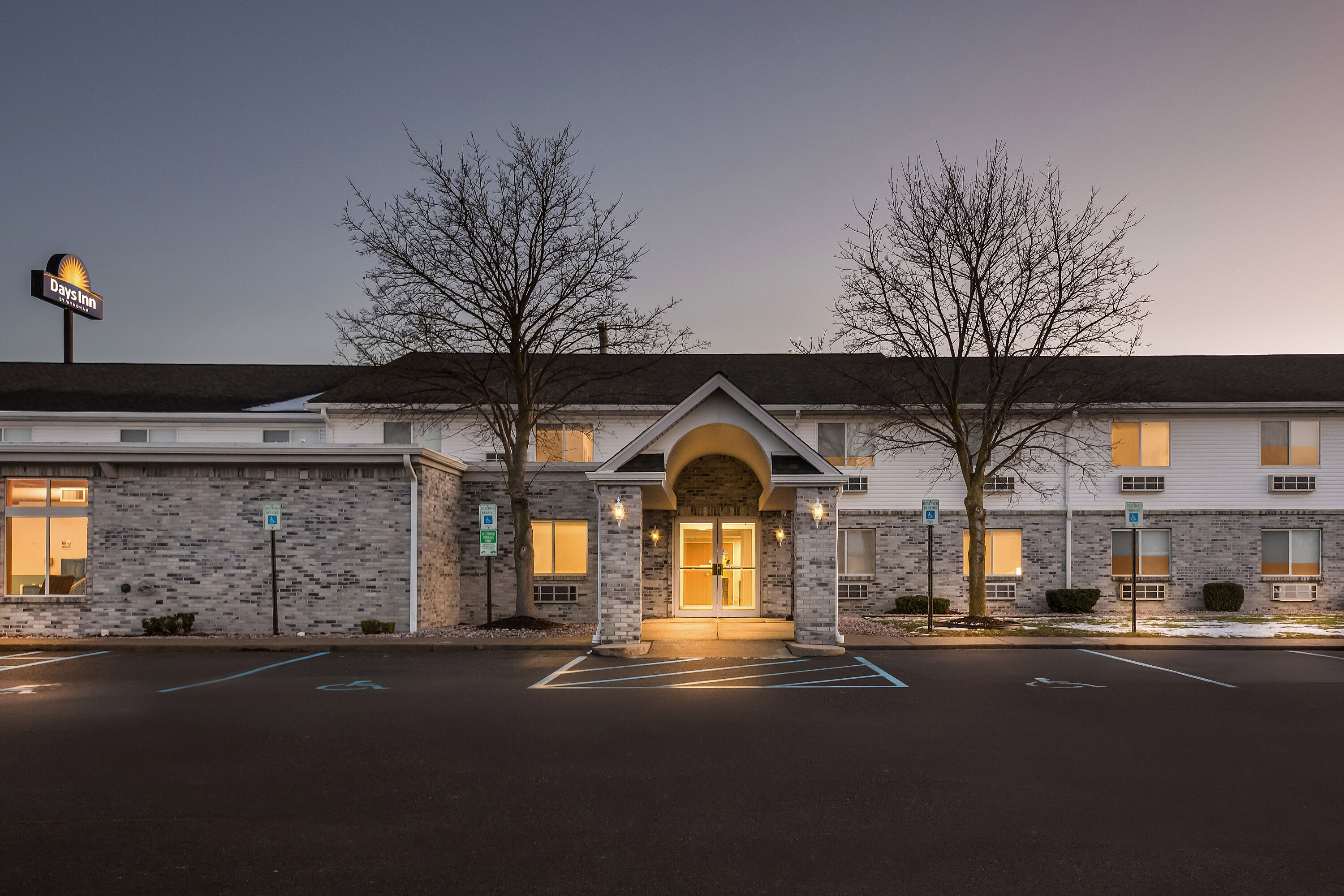 Exterior Night Image of Days Inn by Wyndham Imlay City hotel in Imlay City, Michigan
