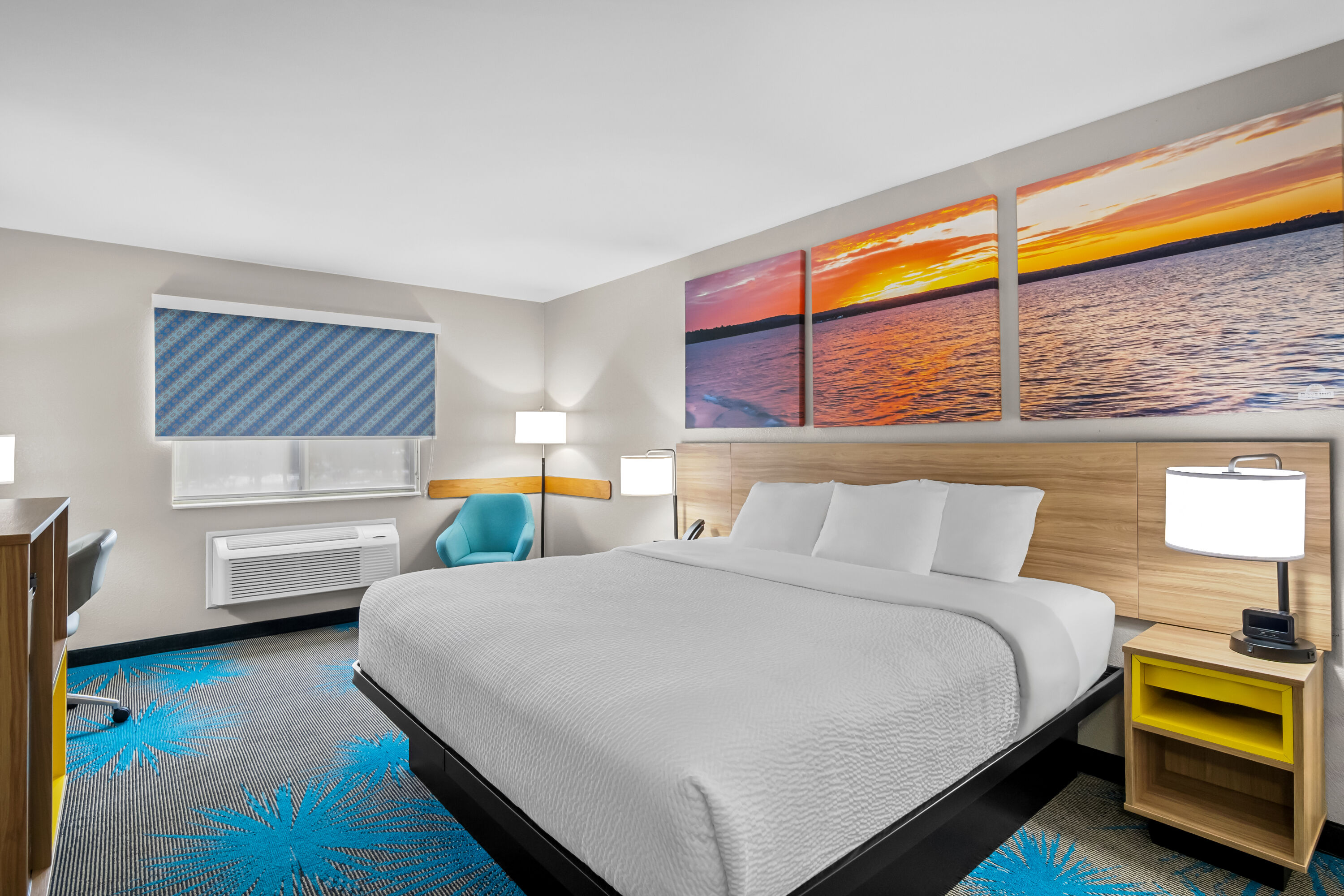 Queen bed guest room at the Days Inn by Wyndham Imlay City in Imlay City, Michigan