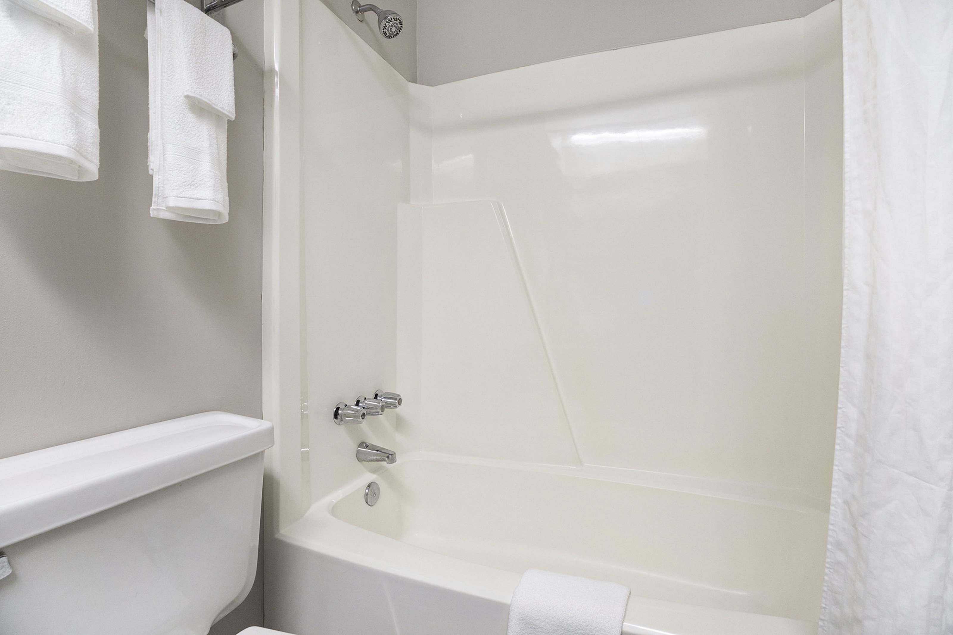 Guest room bath at the Days Inn & Suites by Wyndham Norton Shores/Muskegon in Norton Shores, Michigan