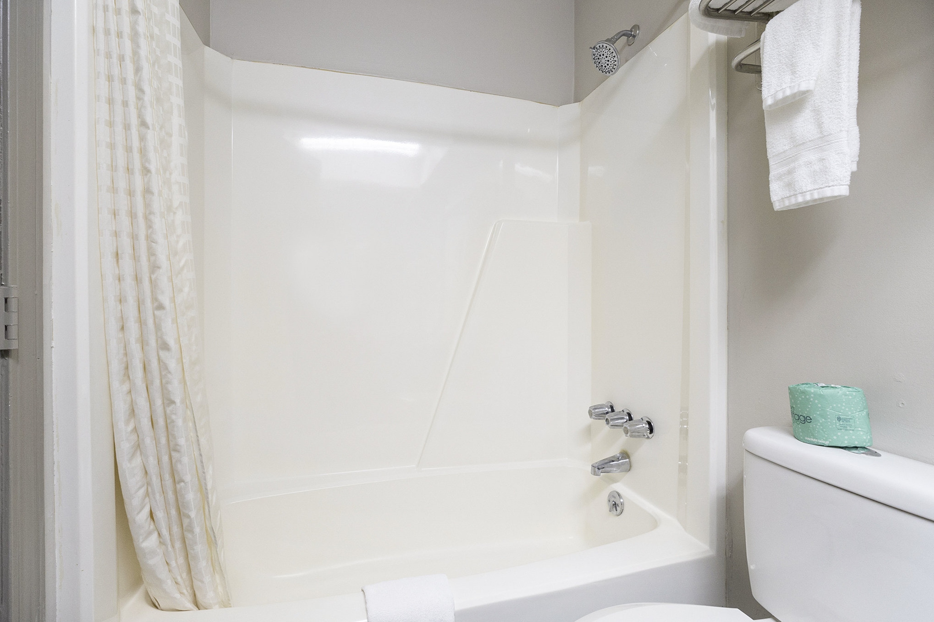 Guest room bath at the Days Inn & Suites by Wyndham Norton Shores/Muskegon in Norton Shores, Michigan