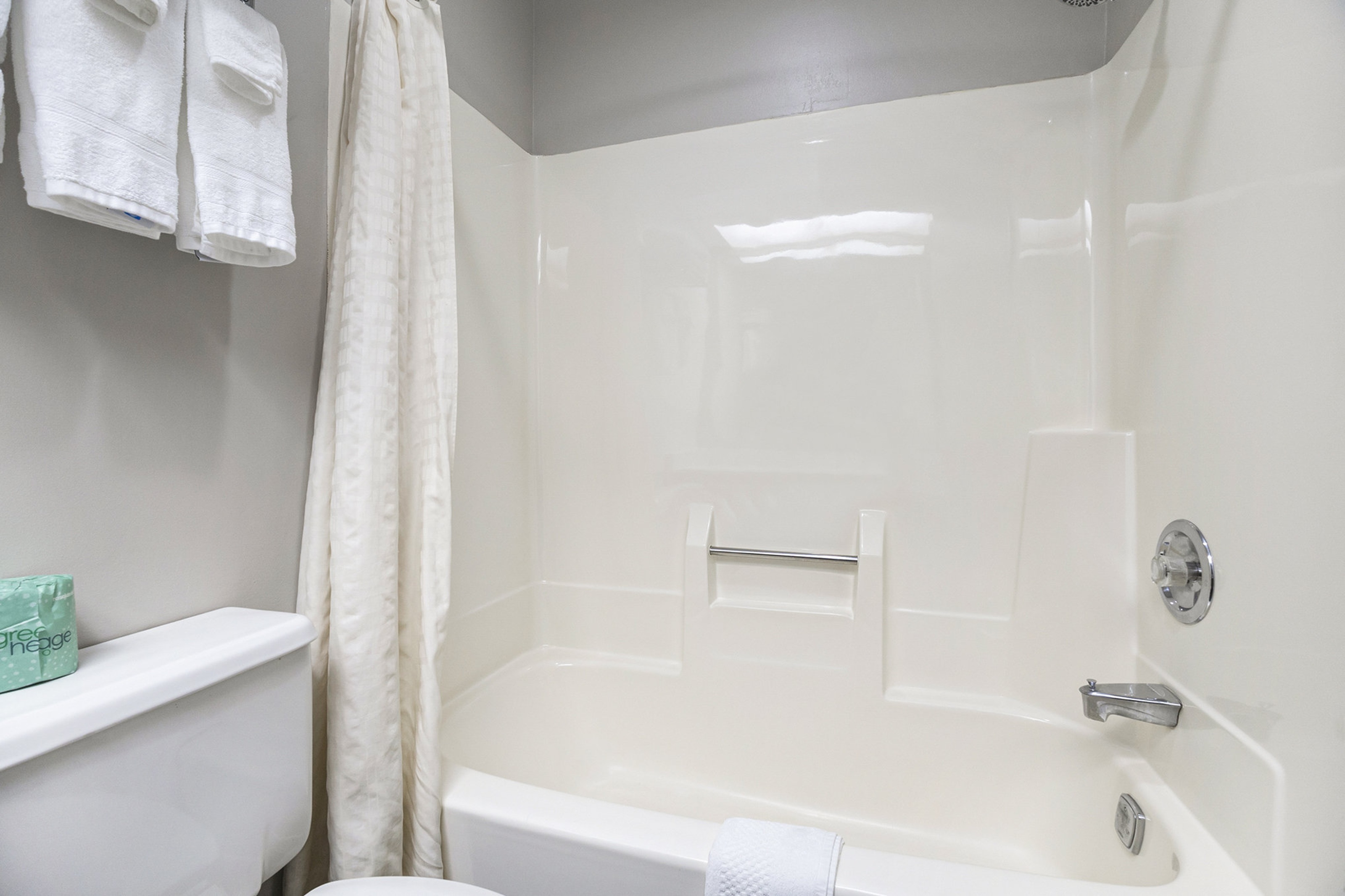 Guest room bath at the Days Inn & Suites by Wyndham Norton Shores/Muskegon in Norton Shores, Michigan