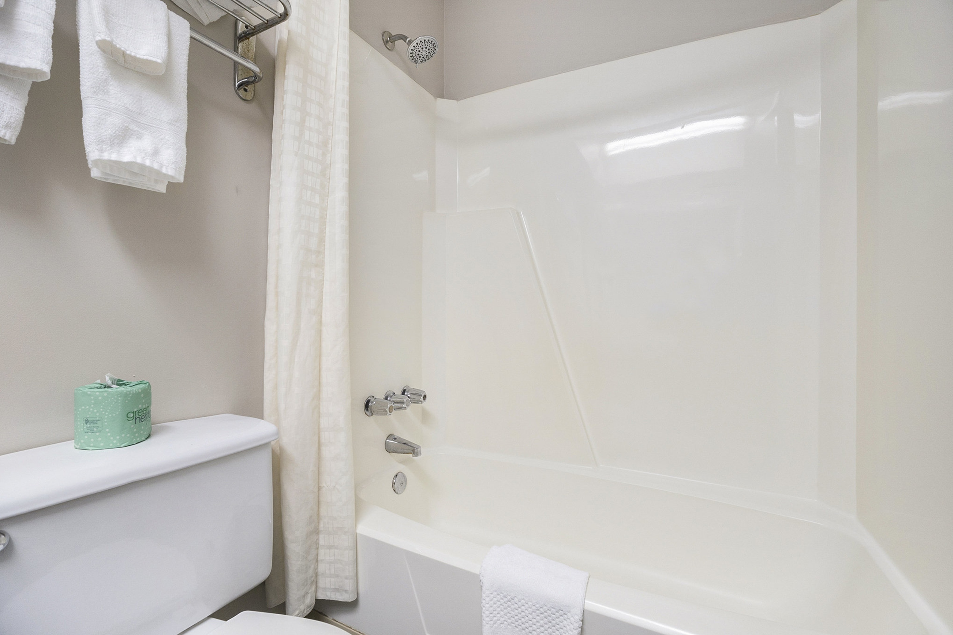 Guest room bath at the Days Inn & Suites by Wyndham Norton Shores/Muskegon in Norton Shores, Michigan