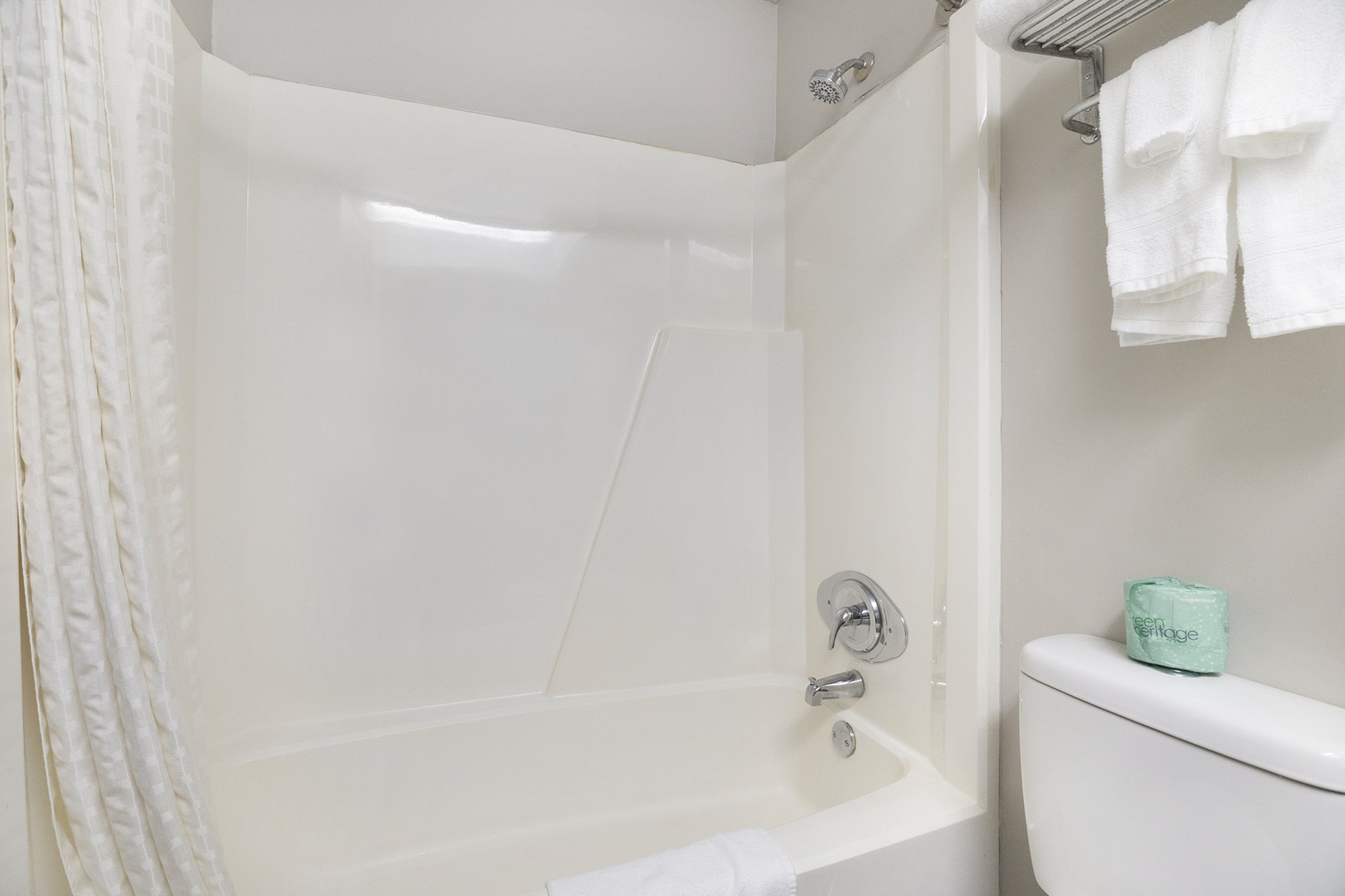Guest room bath at the Days Inn & Suites by Wyndham Norton Shores/Muskegon in Norton Shores, Michigan