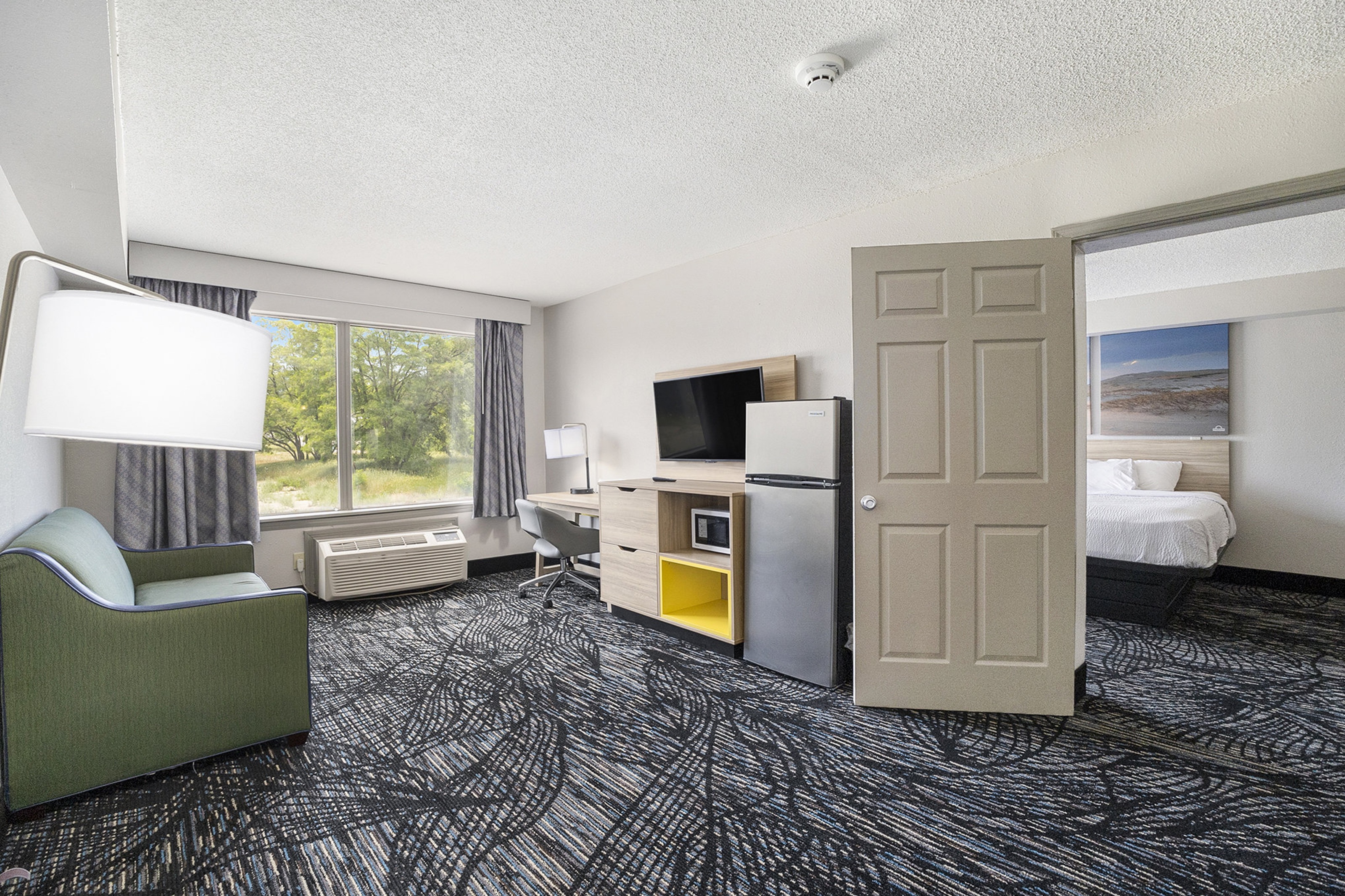 Guest room at the Days Inn & Suites by Wyndham Norton Shores/Muskegon in Norton Shores, Michigan