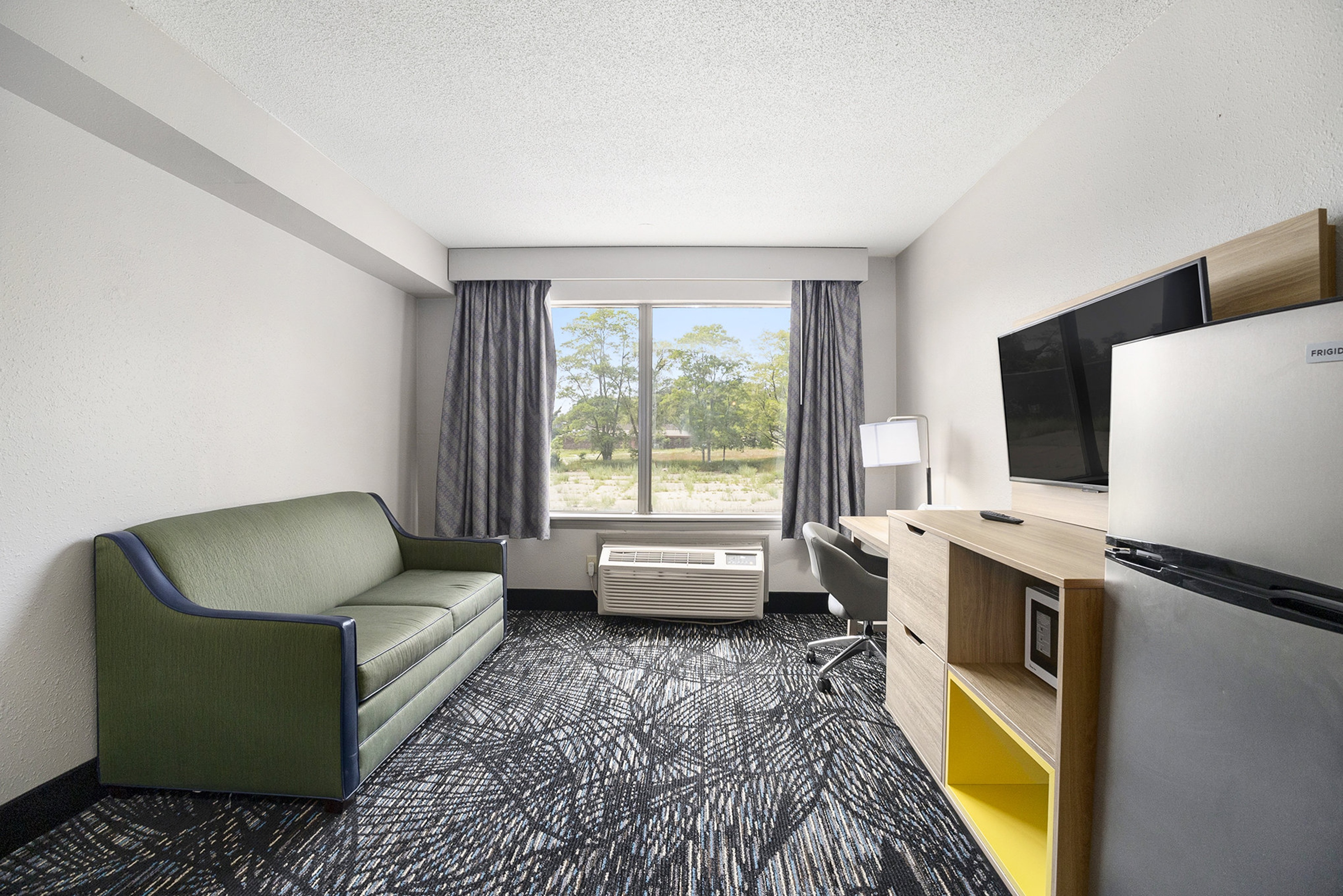Guest room at the Days Inn & Suites by Wyndham Norton Shores/Muskegon in Norton Shores, Michigan