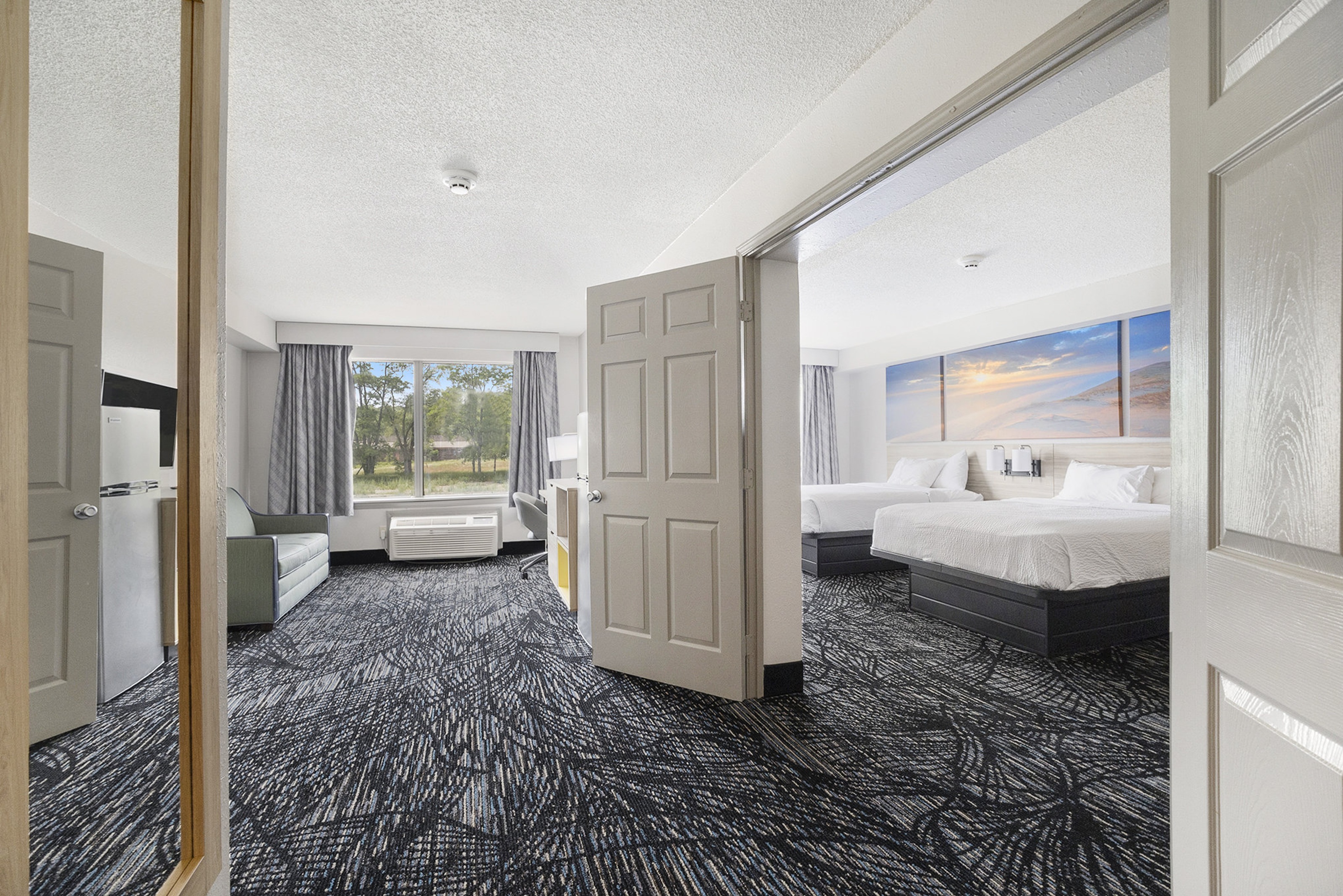 Guest room at the Days Inn & Suites by Wyndham Norton Shores/Muskegon in Norton Shores, Michigan