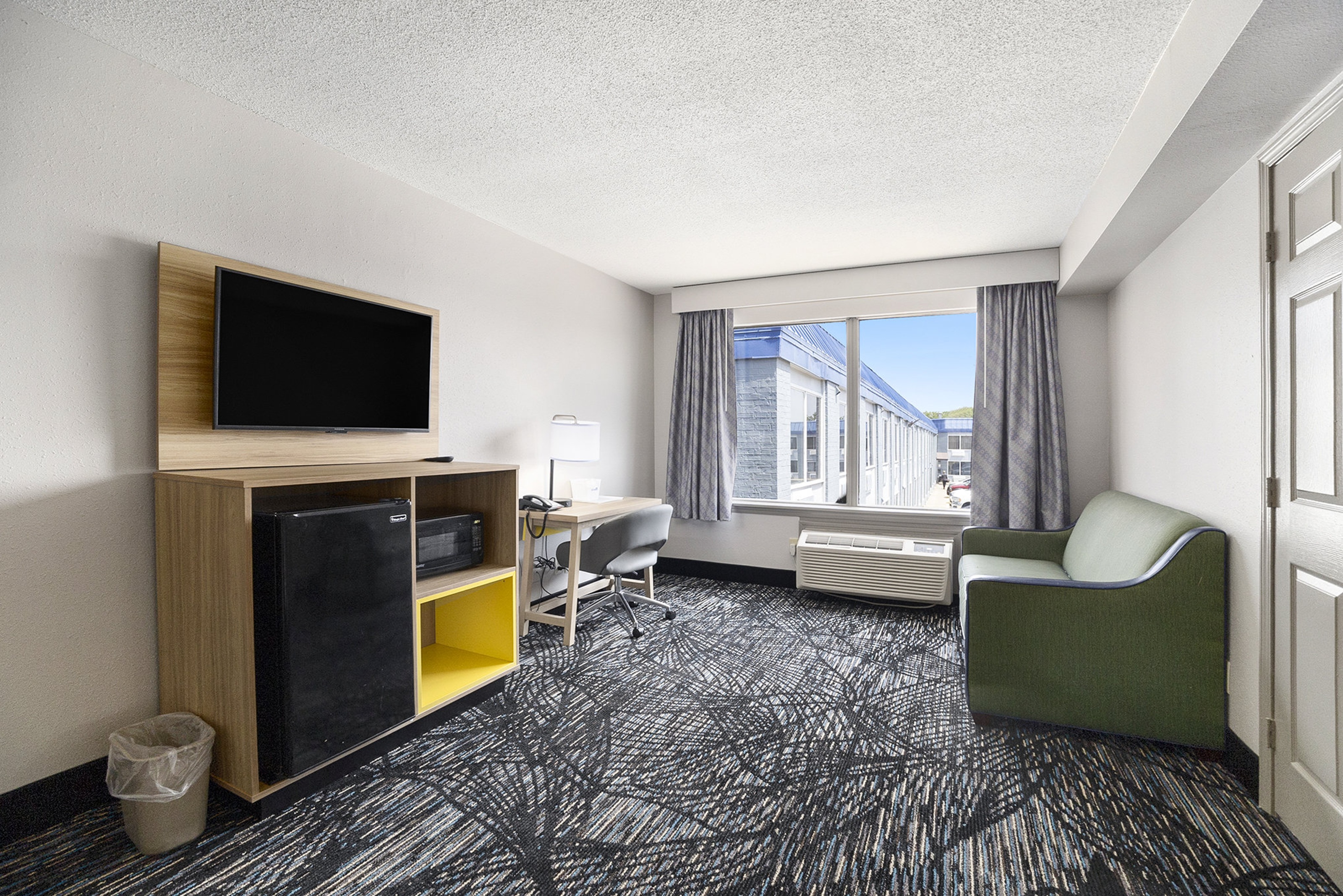 Guest room at the Days Inn & Suites by Wyndham Norton Shores/Muskegon in Norton Shores, Michigan