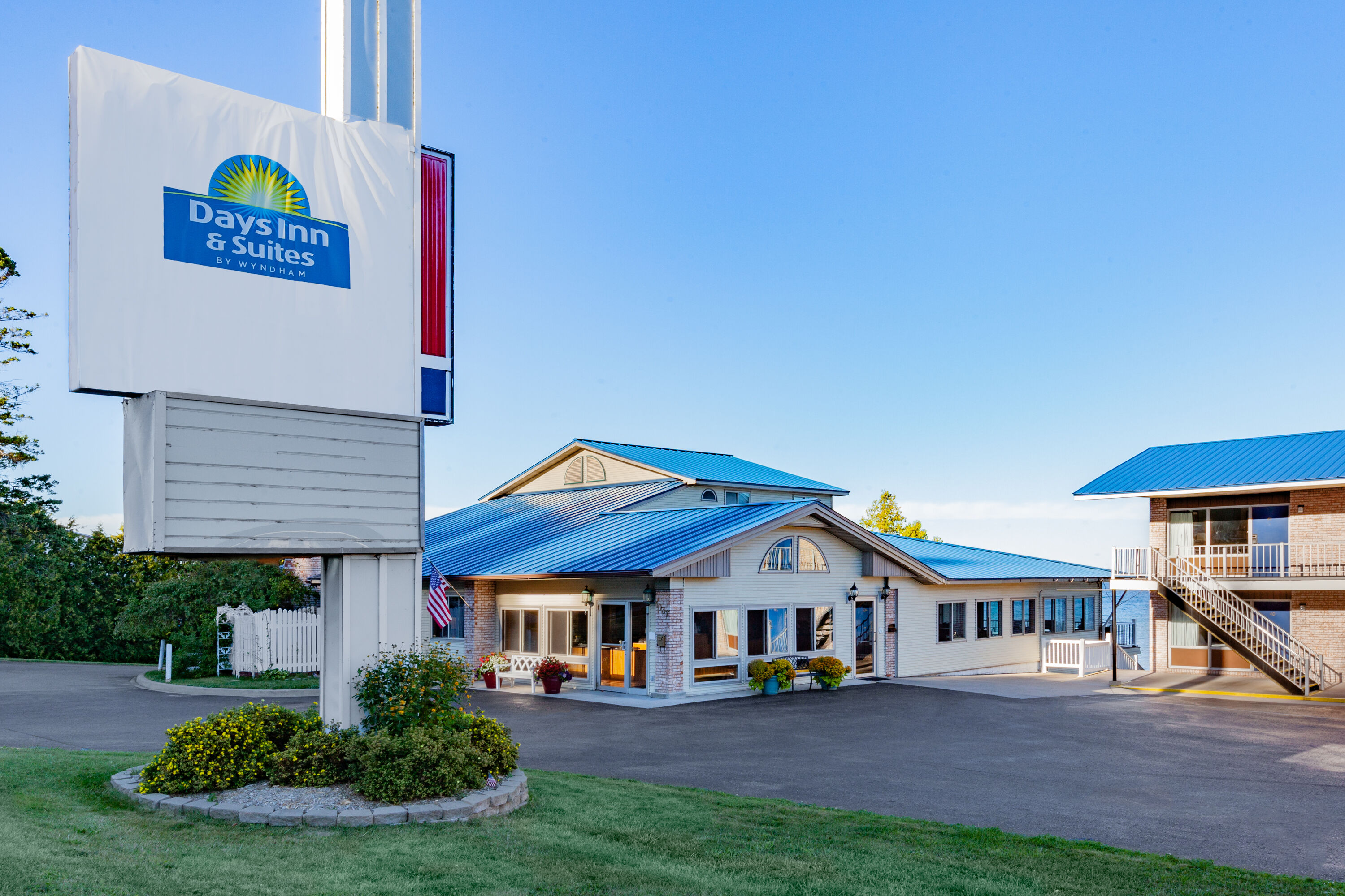 Exterior Day Image of Days Inn & Suites by Wyndham St. Ignace Lakefront hotel in St Ignace, Michigan