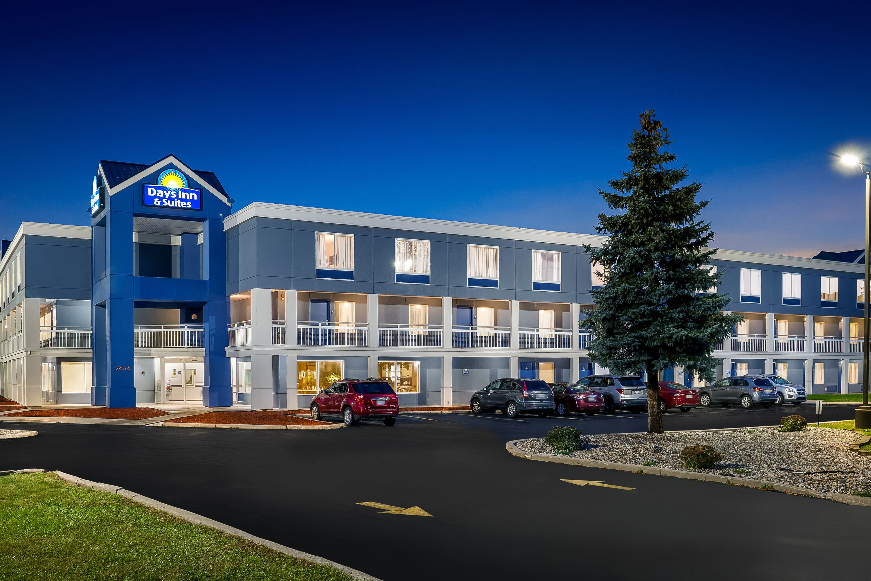 Exterior Night Image of Days Inn & Suites by Wyndham Warren hotel in Warren, Michigan