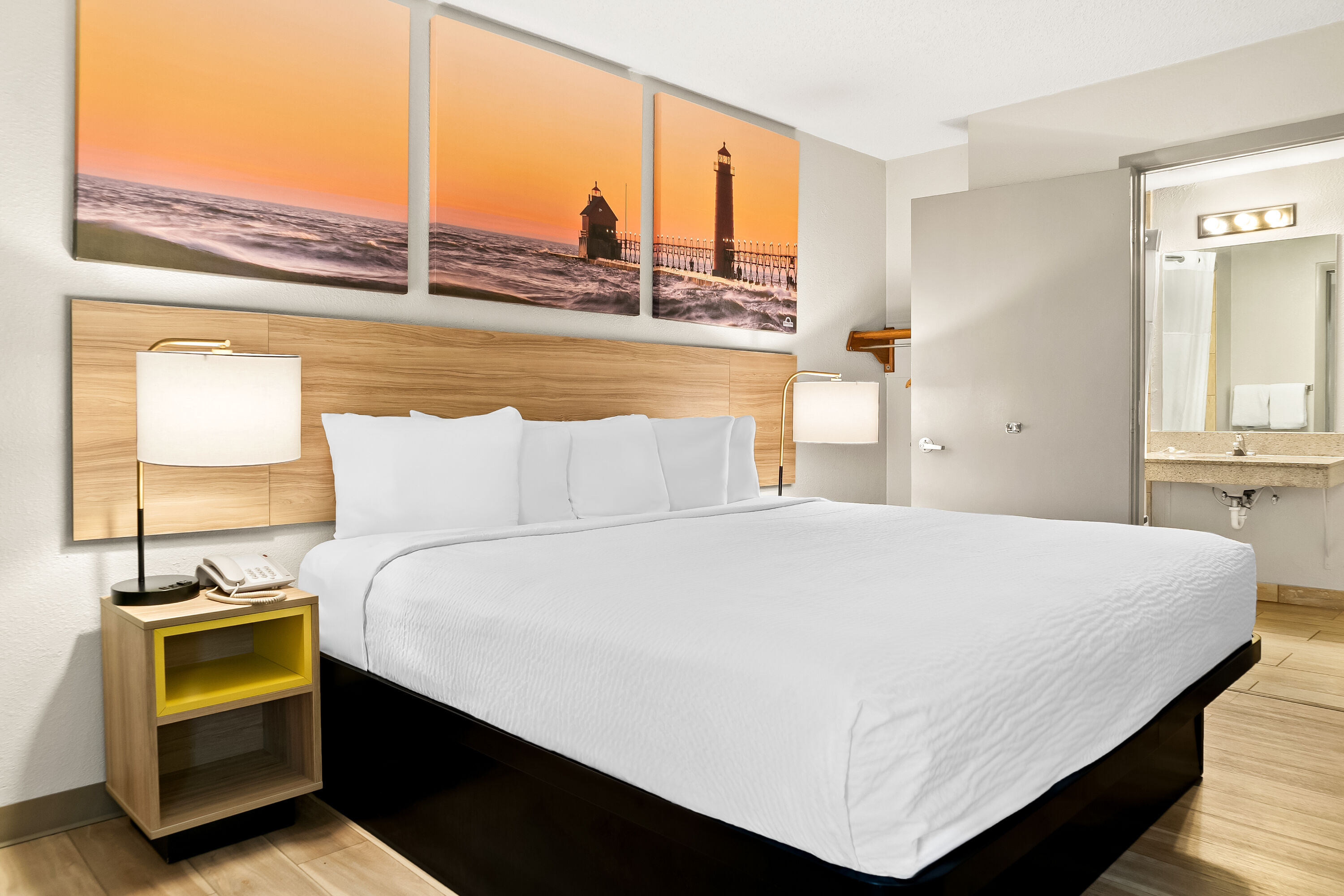 King bed guest room at the Days Inn & Suites by Wyndham Warren in Warren, Michigan