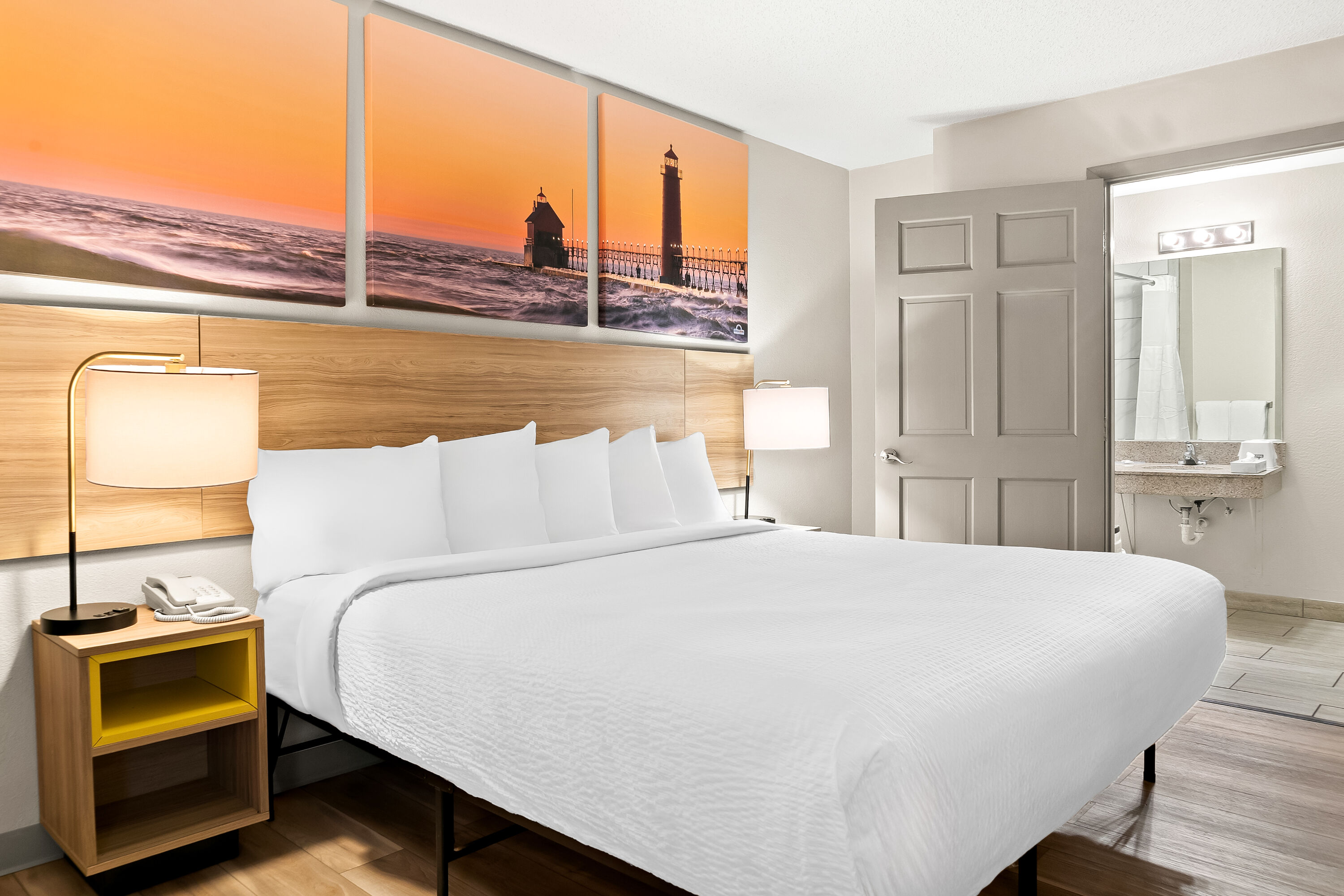 King bed guest room at the Days Inn & Suites by Wyndham Warren in Warren, Michigan