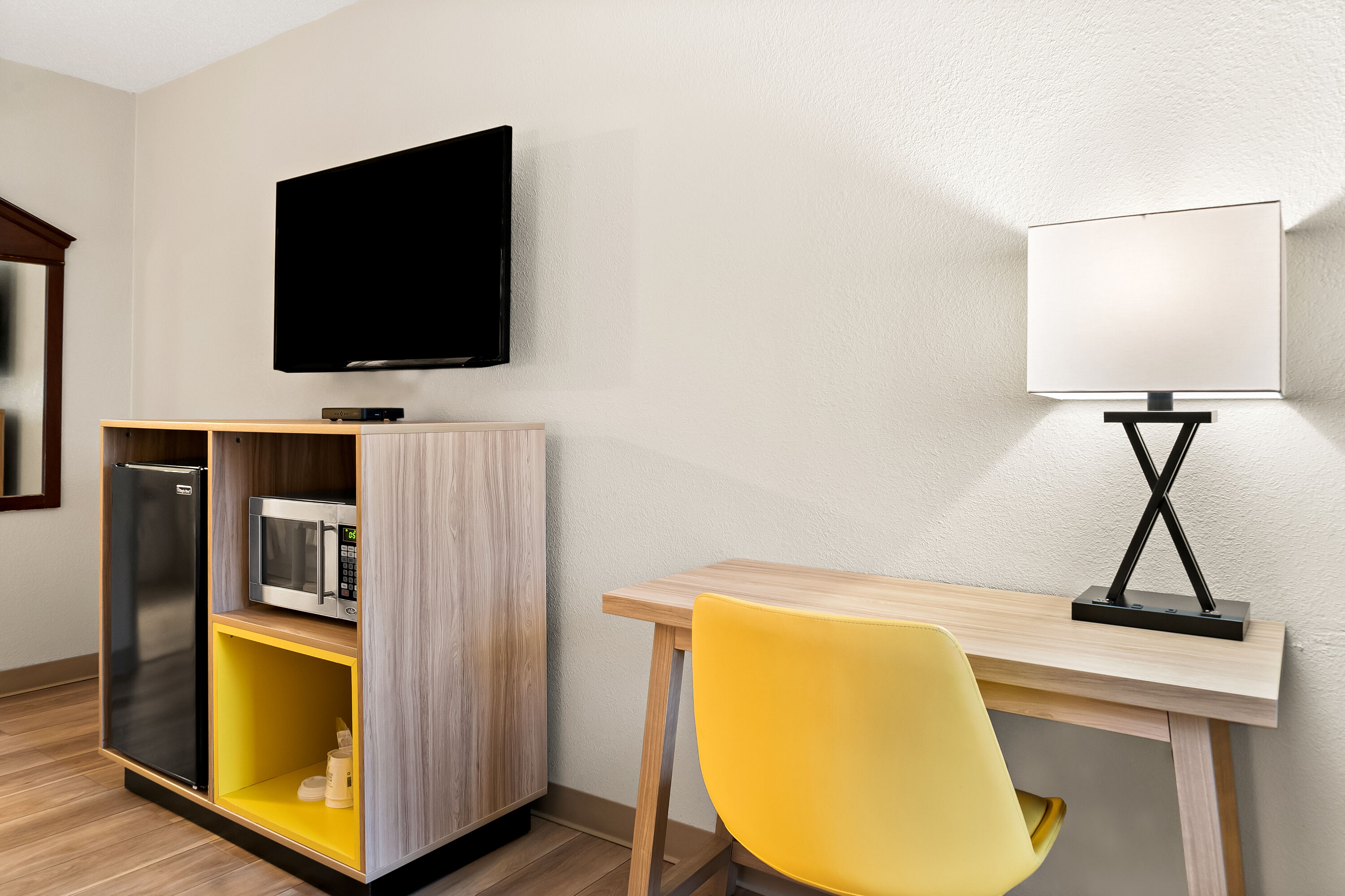 King bed guest room at the Days Inn & Suites by Wyndham Warren in Warren, Michigan