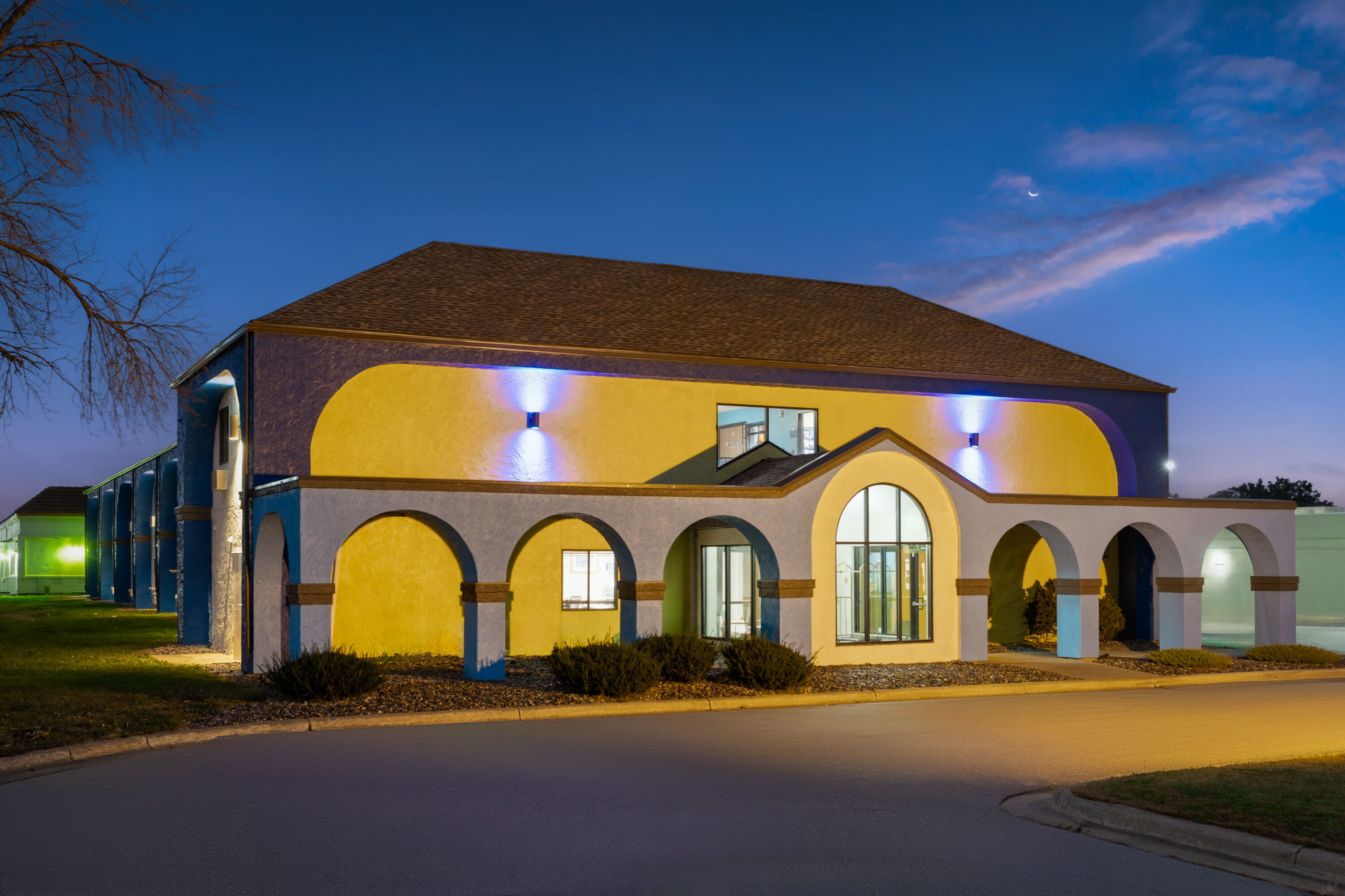 Exterior Dusk Image of Days Inn by Wyndham Austin hotel in Austin, Minnesota
